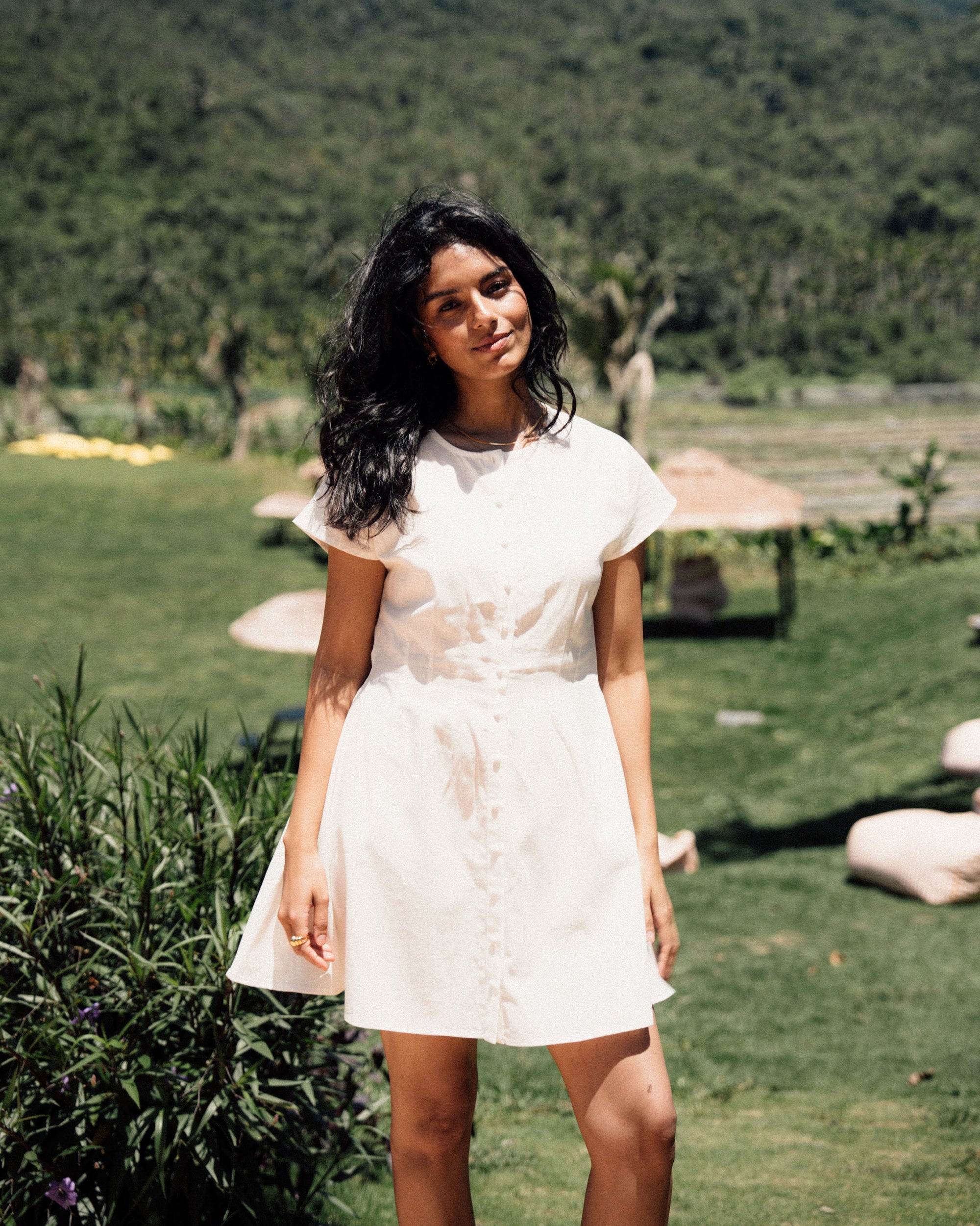 Juana Flora Pleated Shirt Dress White (Tencel–cotton–hemp blend) lifestyle image in nature