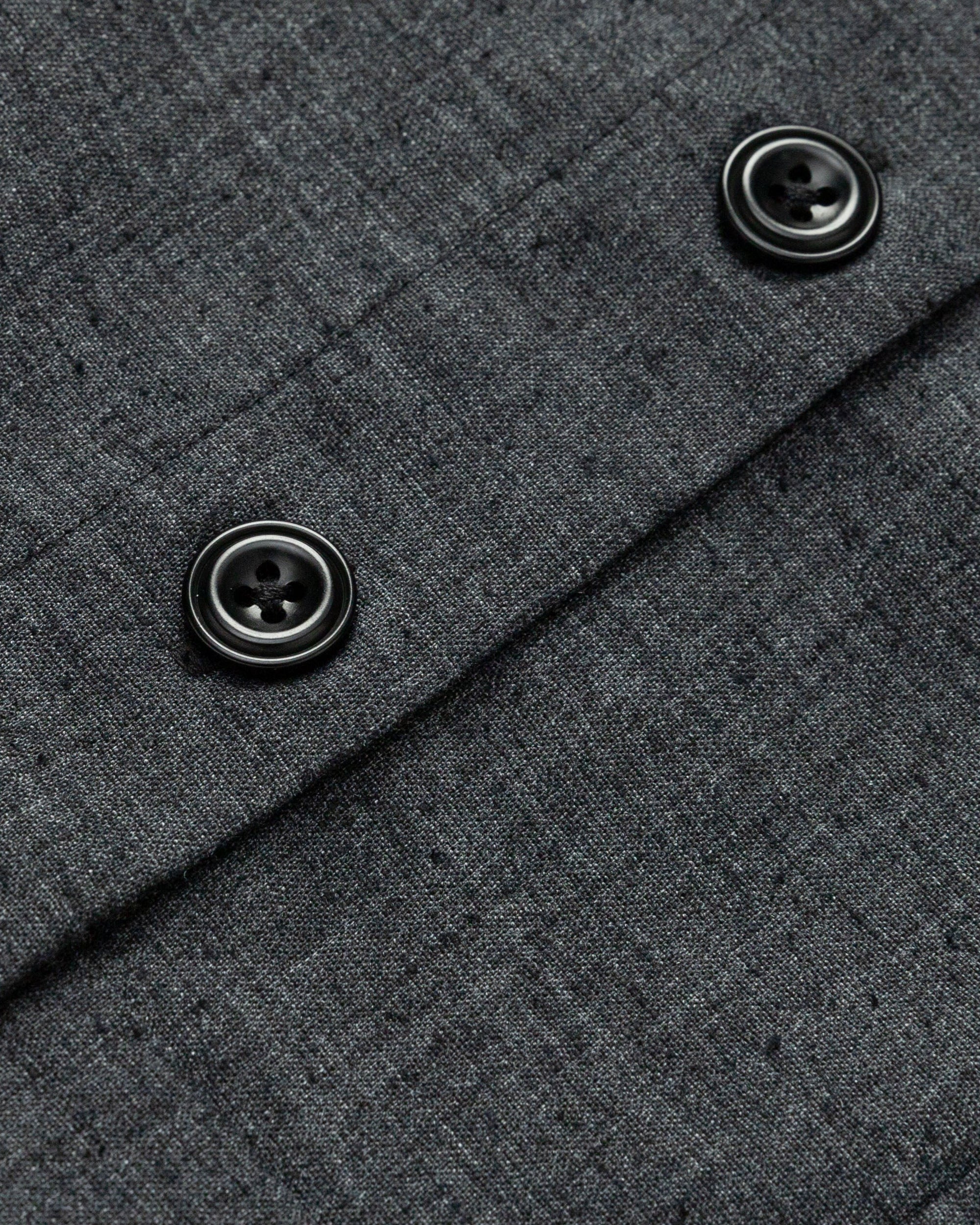 Detail shot of corozo buttons, neckline finish, and fine seaming on the Button Front Top (washed black).