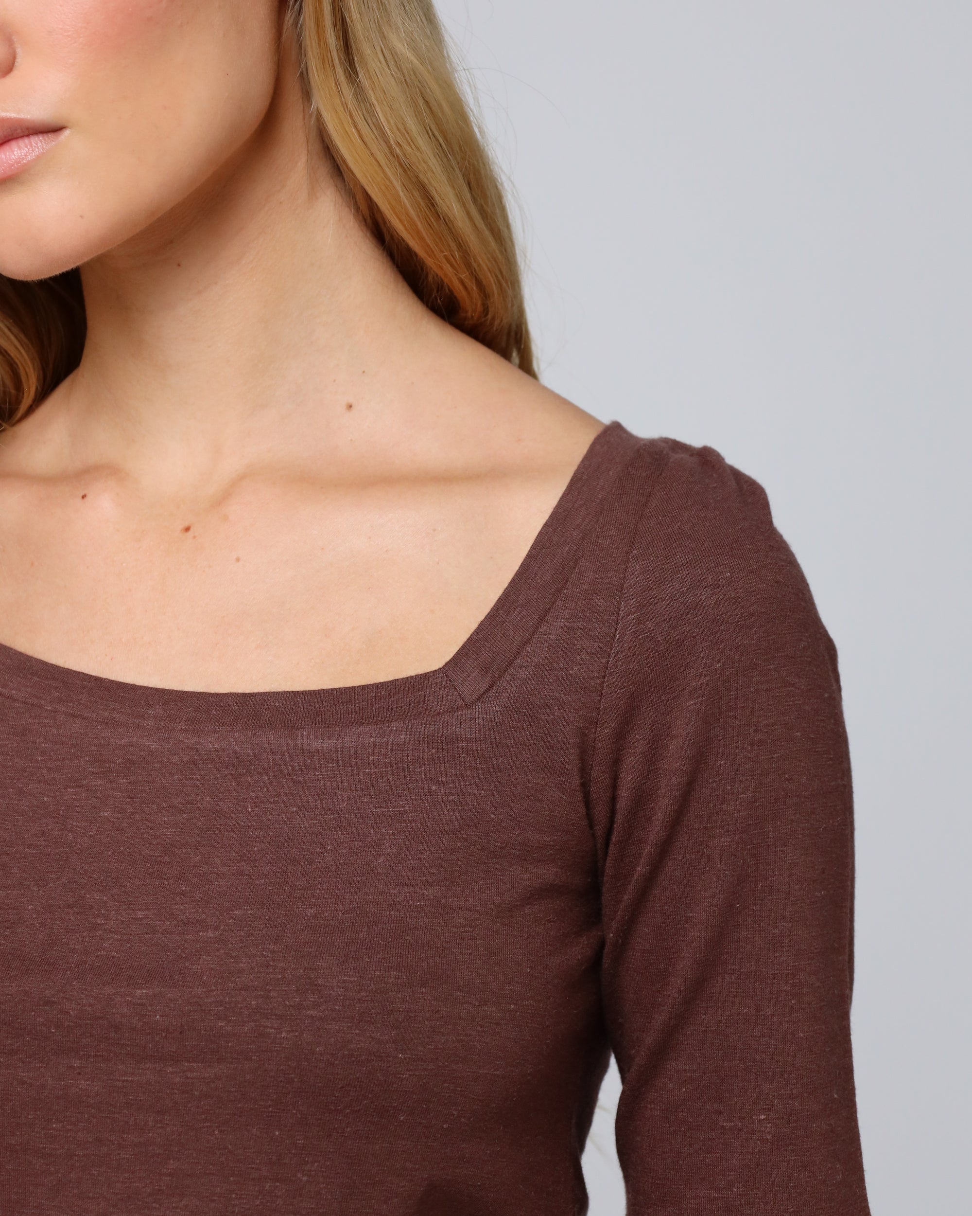 Detail shot of the asymmetrical neckline and seam finish on Asymmetrical Neckline Tee (cacao).