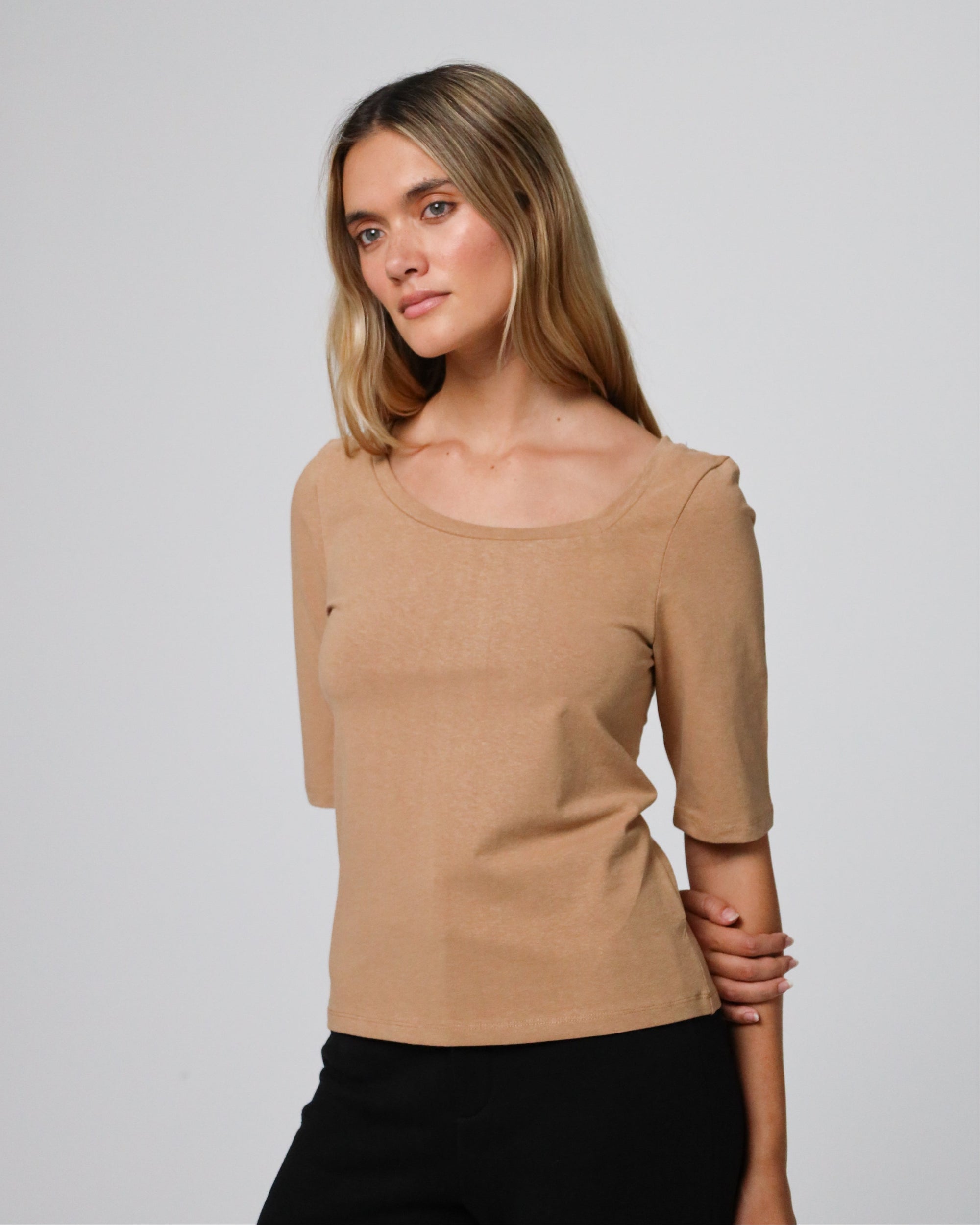 Detail shot of the asymmetrical neckline and seam finish on Asymmetrical Neckline Tee (fawn).
