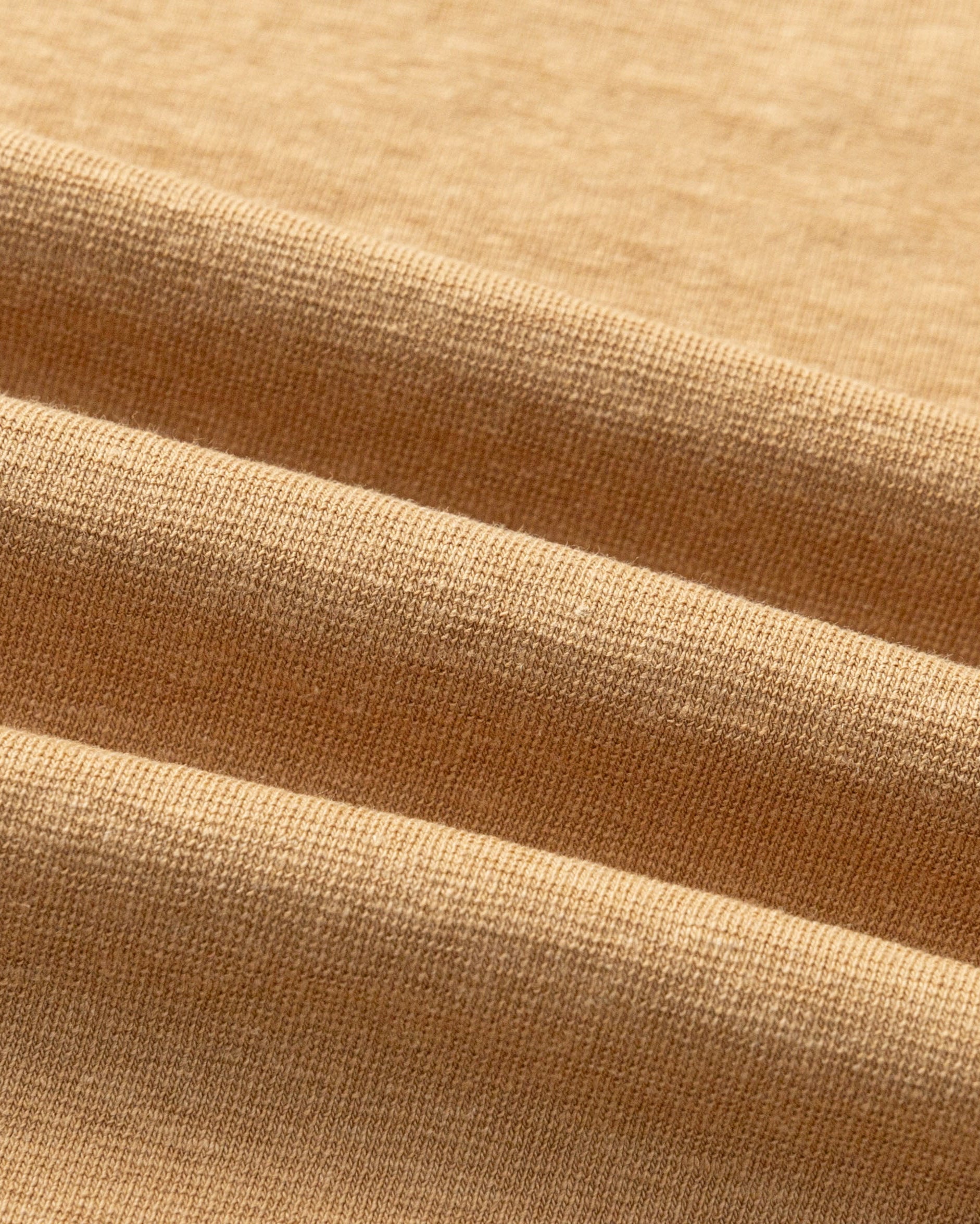 Close-up of hemp–organic cotton stretch knit of Asymmetrical Neckline Tee (fawn), highlighting breathable texture.