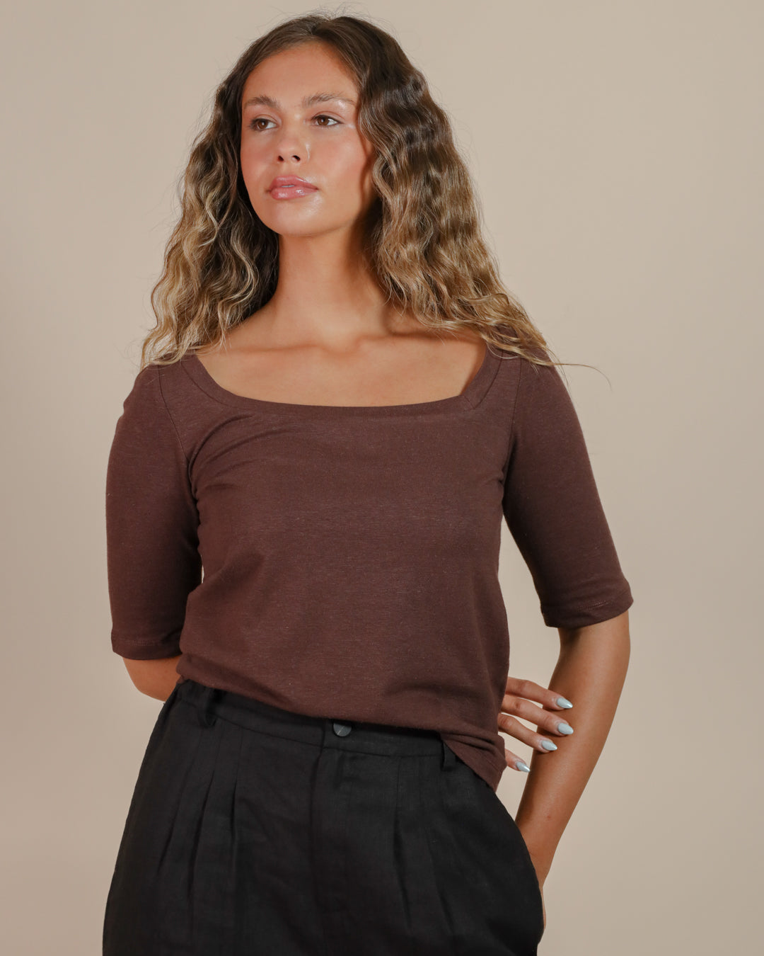 Model wearing Juana Hemp Essentials Asymmetrical Neckline Tee in a hemp organic cotton blend, showcasing the off-center neckline.