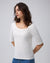 Model styling Asymmetrical Neckline Tee (white) with tailored trousers for minimalist polish.