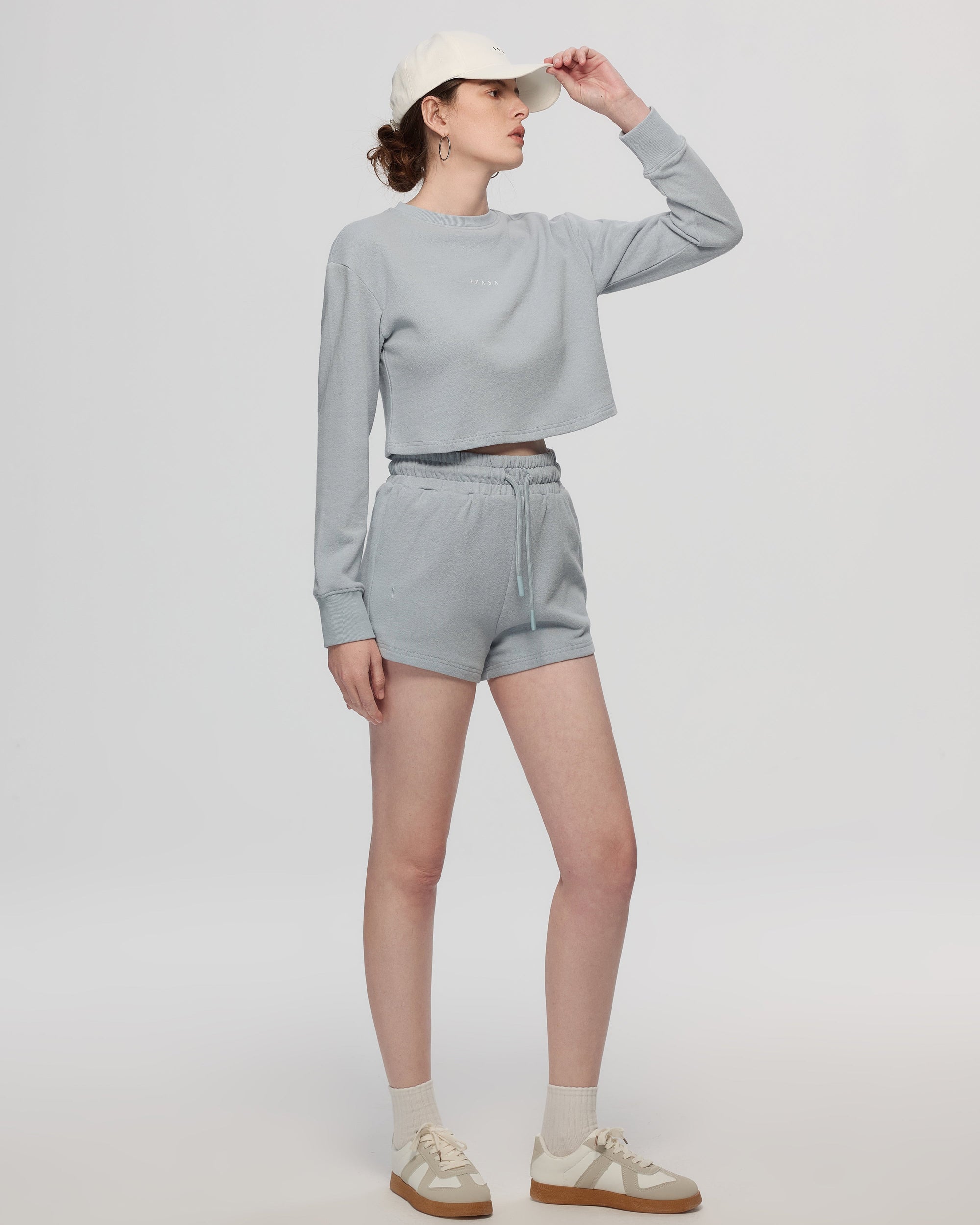 Juana Hemp Essentials Cap (white) complete outfit view featuring Off Hours Natural Crewneck Sweater and Hemp Essentials French Terry Shorts (blue)