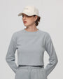 Woman wearing Juana Hemp Essentials Cap in white organic-cotton–hemp blend, styled for sustainable everyday wear.