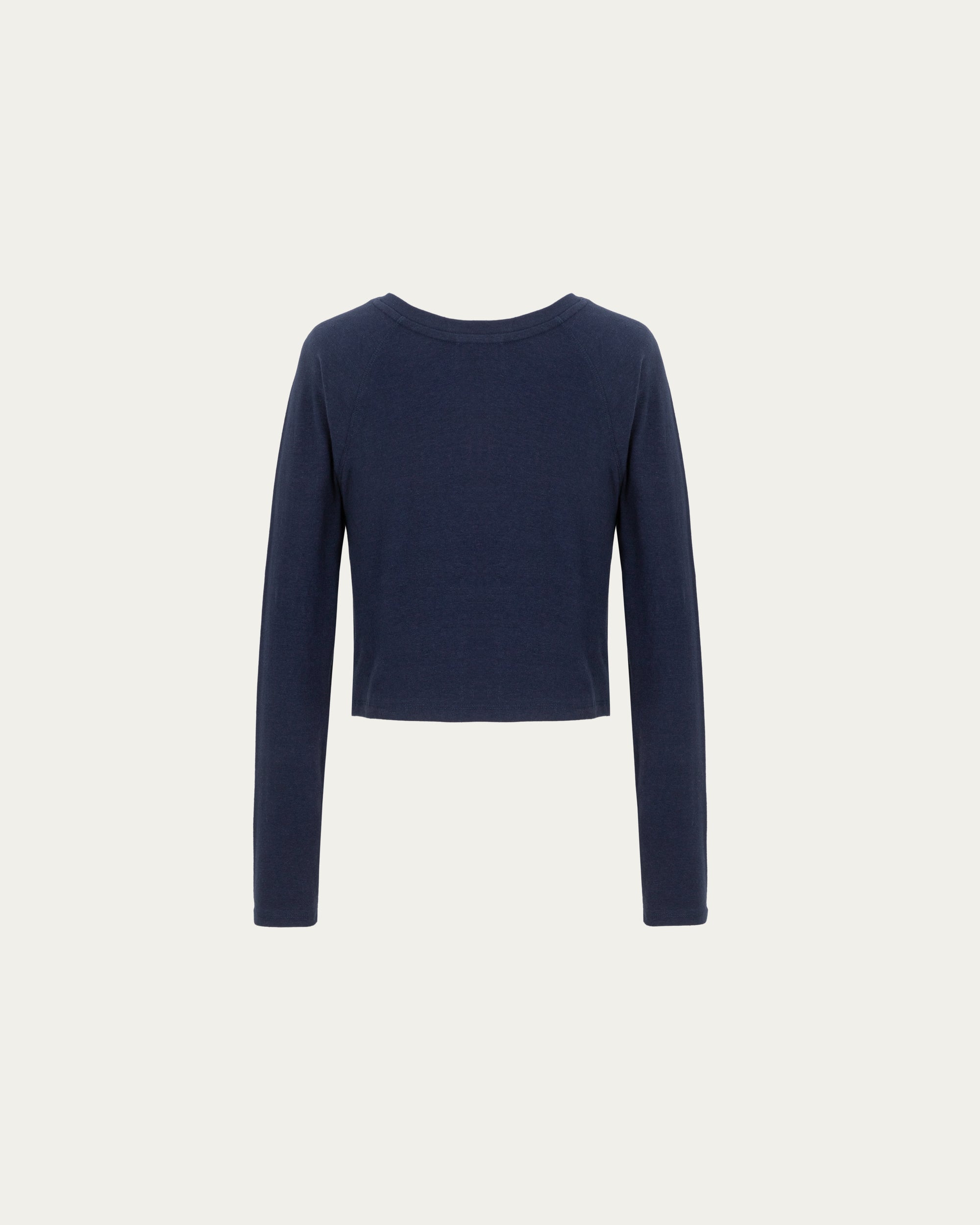 Cropped Raglan Tee (indigo blue) on ghost mannequin, back view showing cropped length and clean construction.