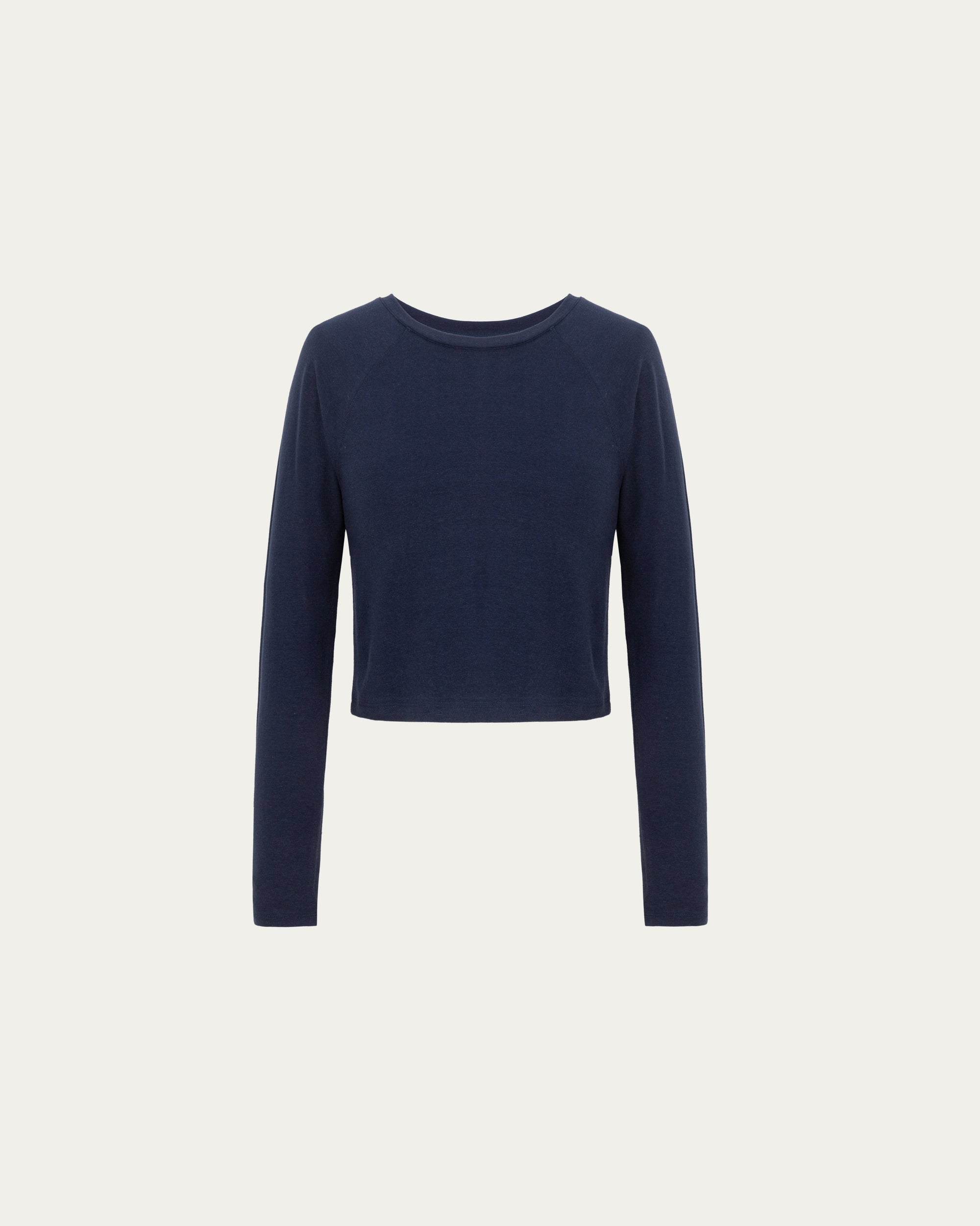 Cropped Raglan Tee (indigo blue) on ghost mannequin, front view highlighting crewneck and raglan sleeves.