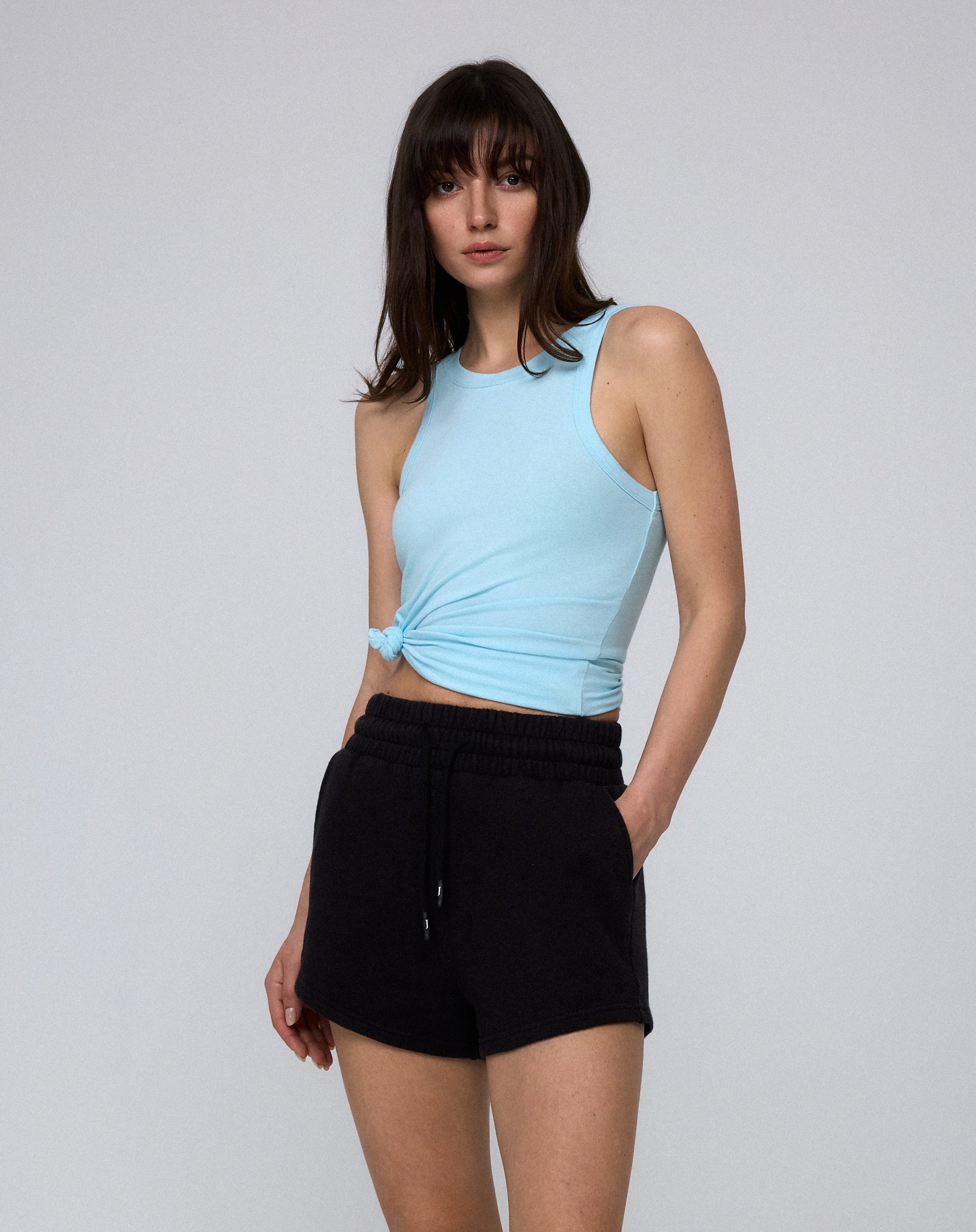 Model styling Fleece Shorts (black) with the Hemp Essentials Tank in Sky Blue