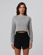 Model styling Fleece Shorts (black) with the Fleece Cropped Sweater for a coordinated set.