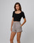 Woman wearing Fleece Shorts in gray hemp–organic cotton blend, styled for sustainable everyday wear.