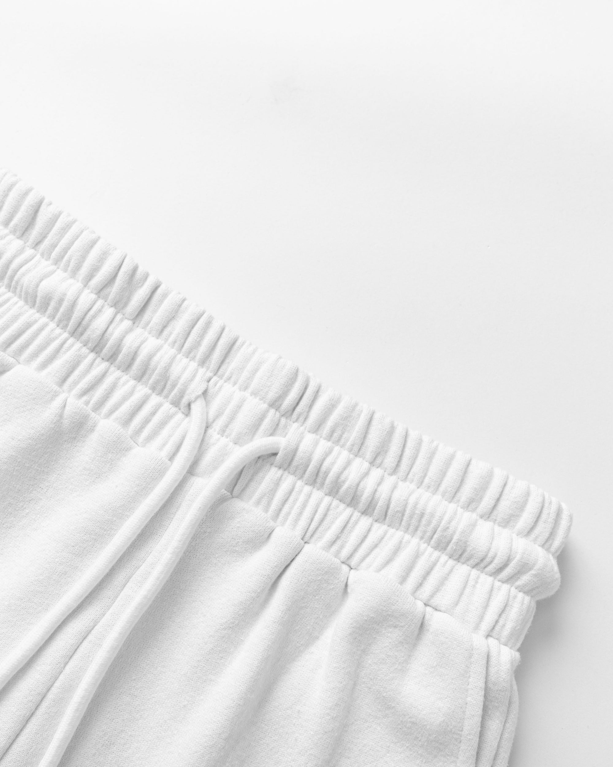 Detail shot of waistband and stitching on Fleece Shorts (white).