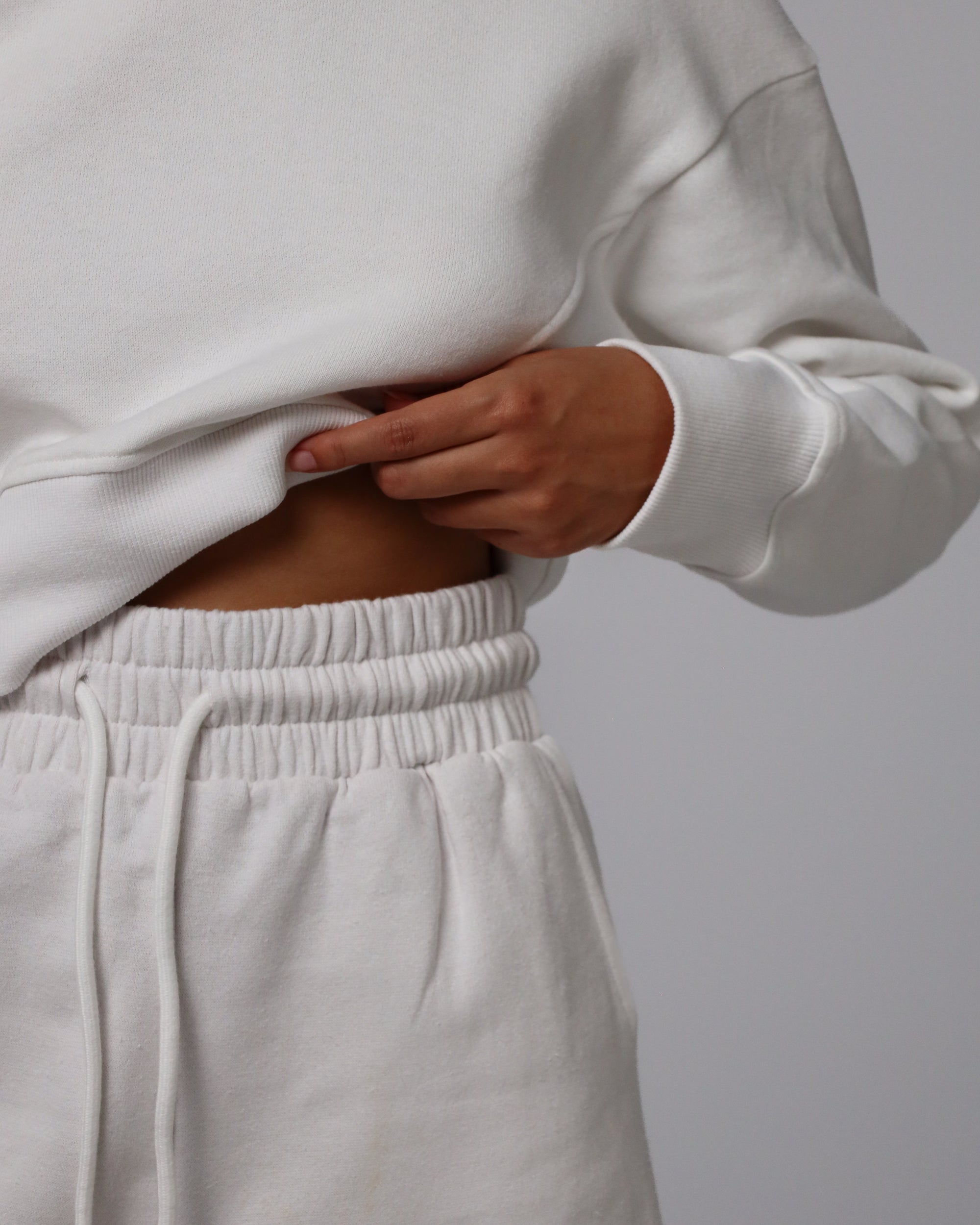 Detail shot of waistband and stitching on Fleece Shorts (white).