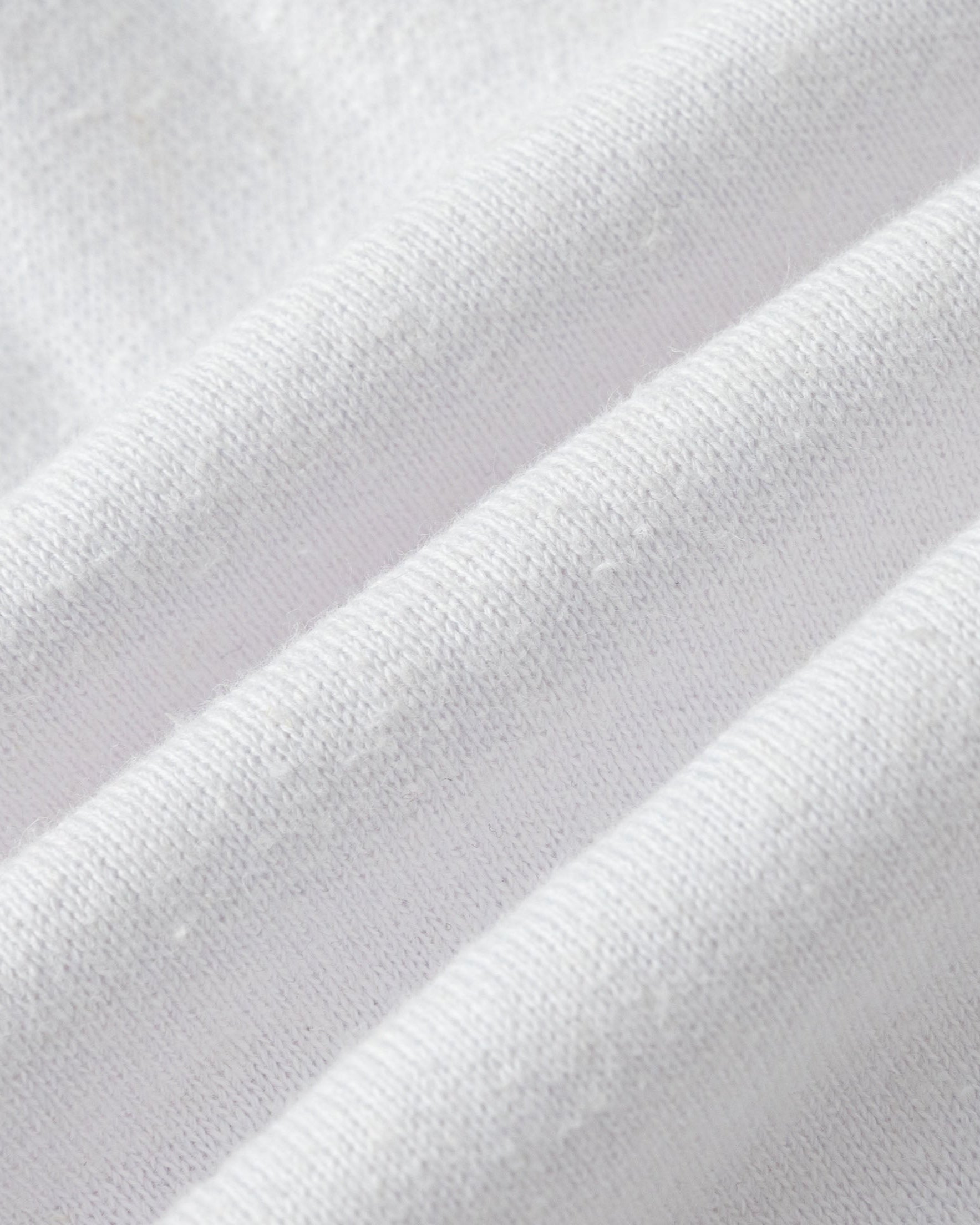 Close-up of hemp–organic cotton fleece knit of Fleece Shorts (white).
