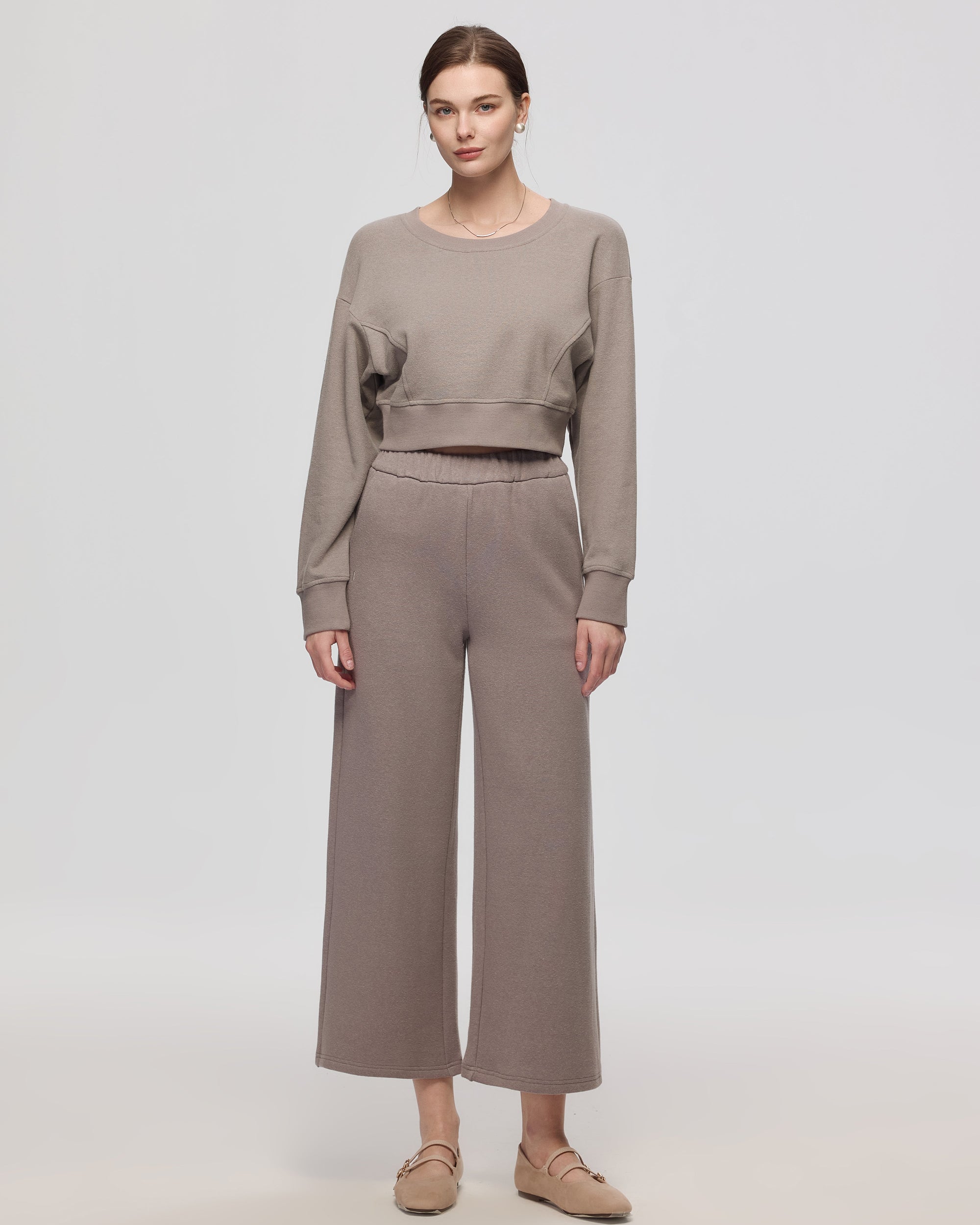 Model wearing gray Hemp Essentials Fleece Sweatpants (hemp–organic cotton); 7/8 length; straight‑on front.