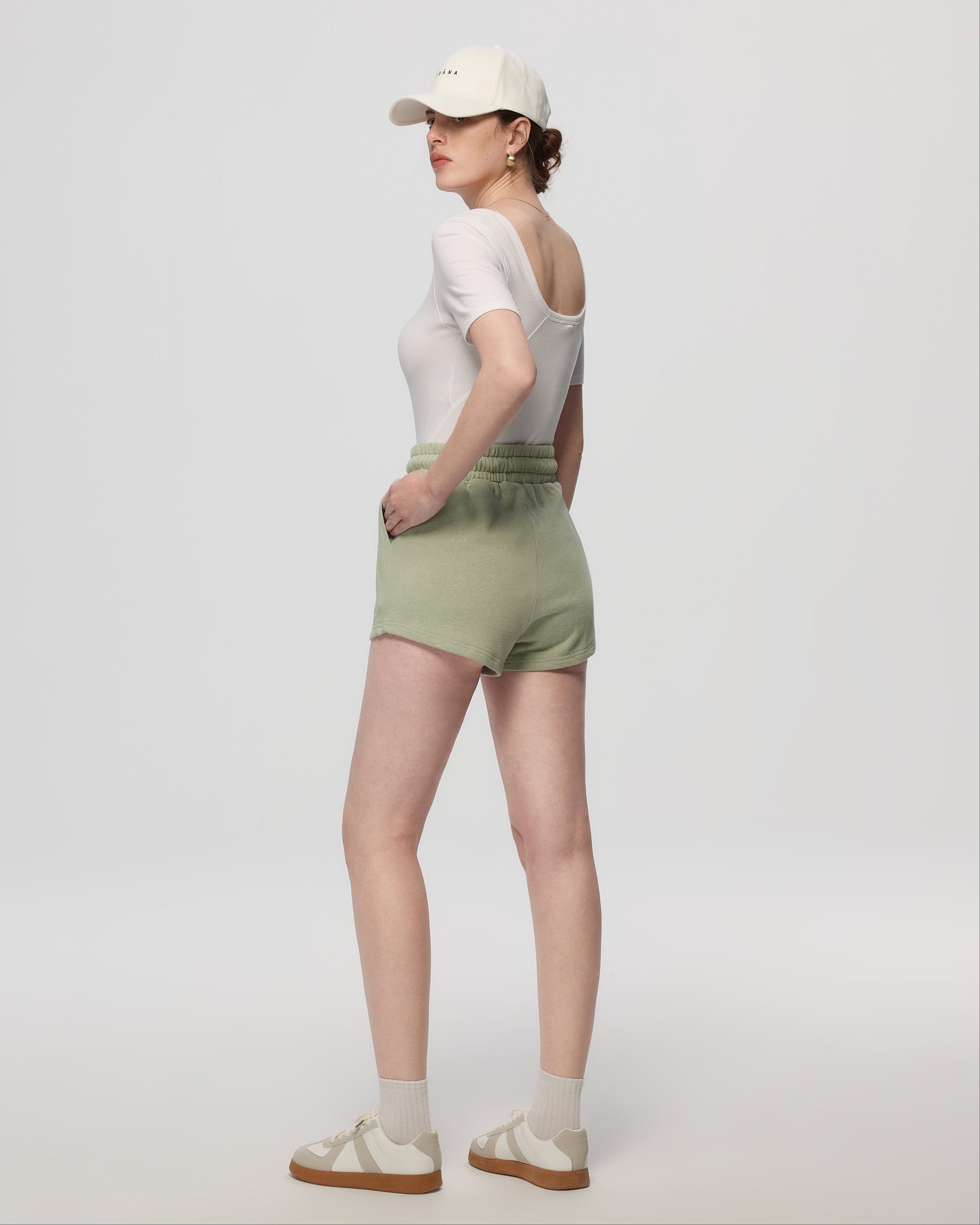 Juana Hemp Essentials French Terry Shorts light sage (sustainable hemp–organic cotton) back view on model showing drape and coverage