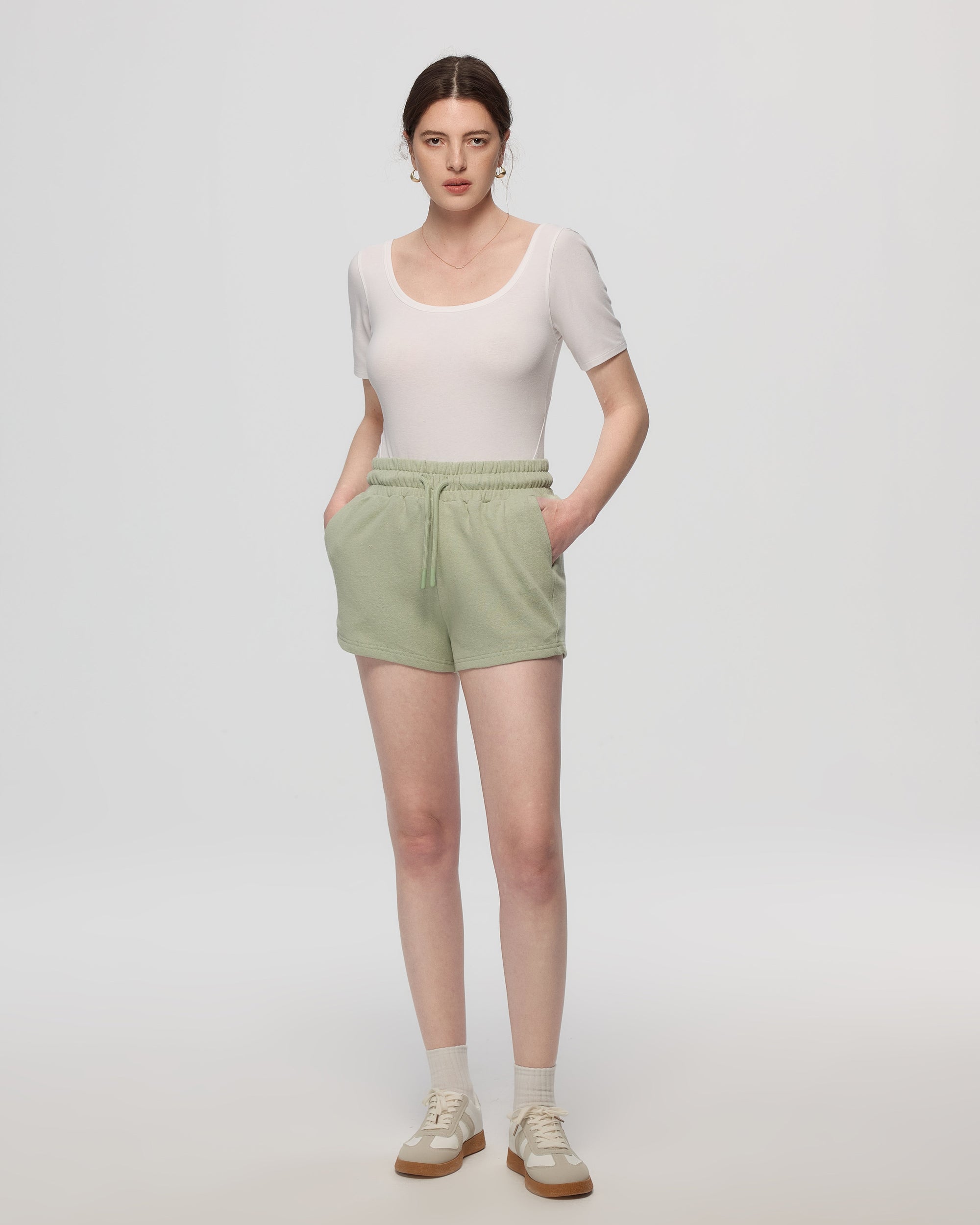 Juana Hemp Essentials French Terry Shorts light sage (sustainable hemp–organic cotton) styled with Juana Classics Squareneck T-Shirt in white showing pull-on comfort
