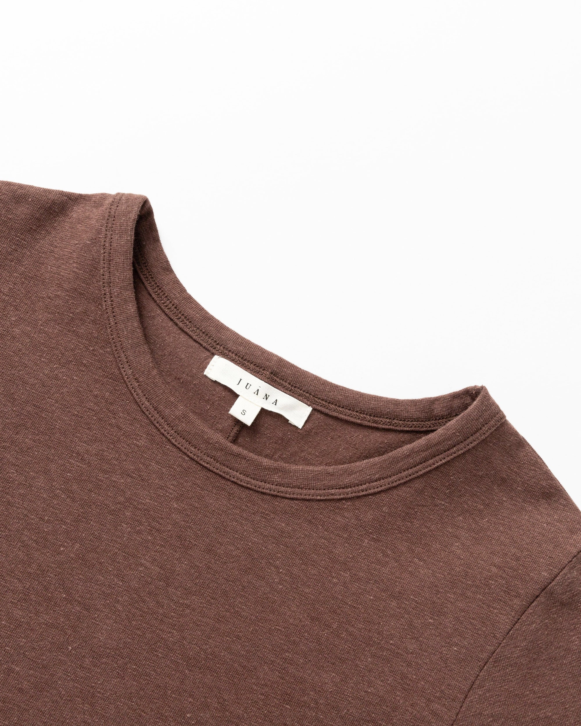 Detail shot of neckline, sleeve hem, and stitching on Long Sleeve Tee (cocoa).