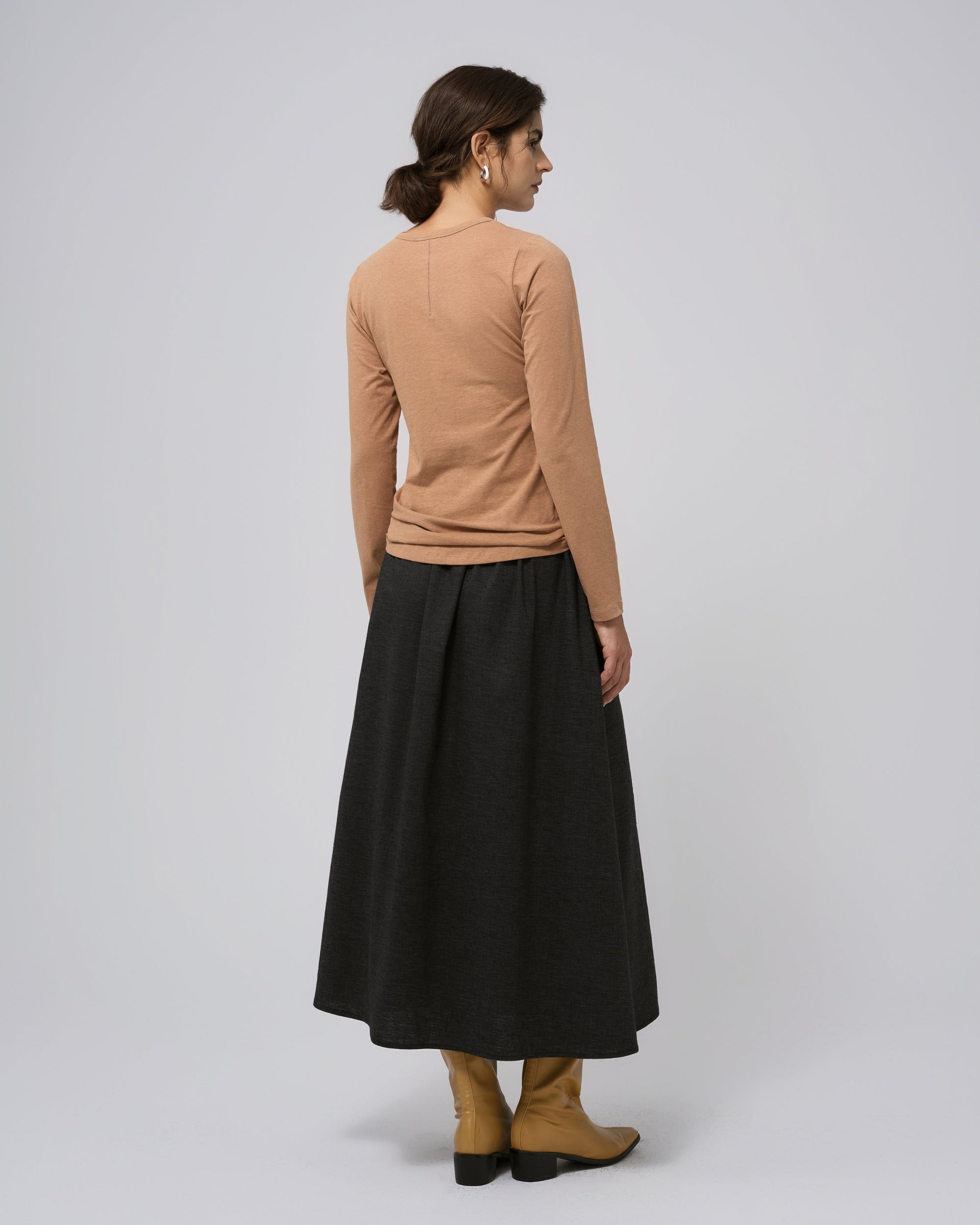 Model back view of Hemp Essentials Long Sleeve Tee fawn, showing clean back seam and natural drape.
