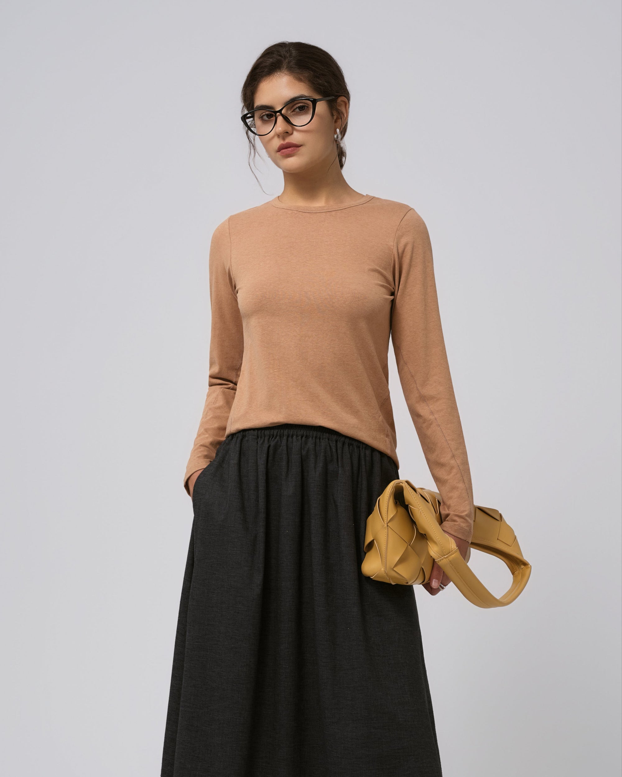 Model wearing Juana Hemp Essentials Long Sleeve Tee in fawn (hemp–organic cotton blend), showing clean crewneck and relaxed, breathable drape.