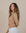 Model wearing Juana Hemp Essentials Long Sleeve Tee in natural hemp and organic cotton blend, featuring scoop hem and clean silhouette.