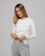 Woman wearing Juana Hemp Essentials Long Sleeve Tee in white hemp–organic cotton blend, styled for sustainable everyday wear.