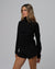 Woman wearing Juana Hemp Essentials Mockneck in black hemp–organic cotton stretch blend, styled for sustainable everyday wear.