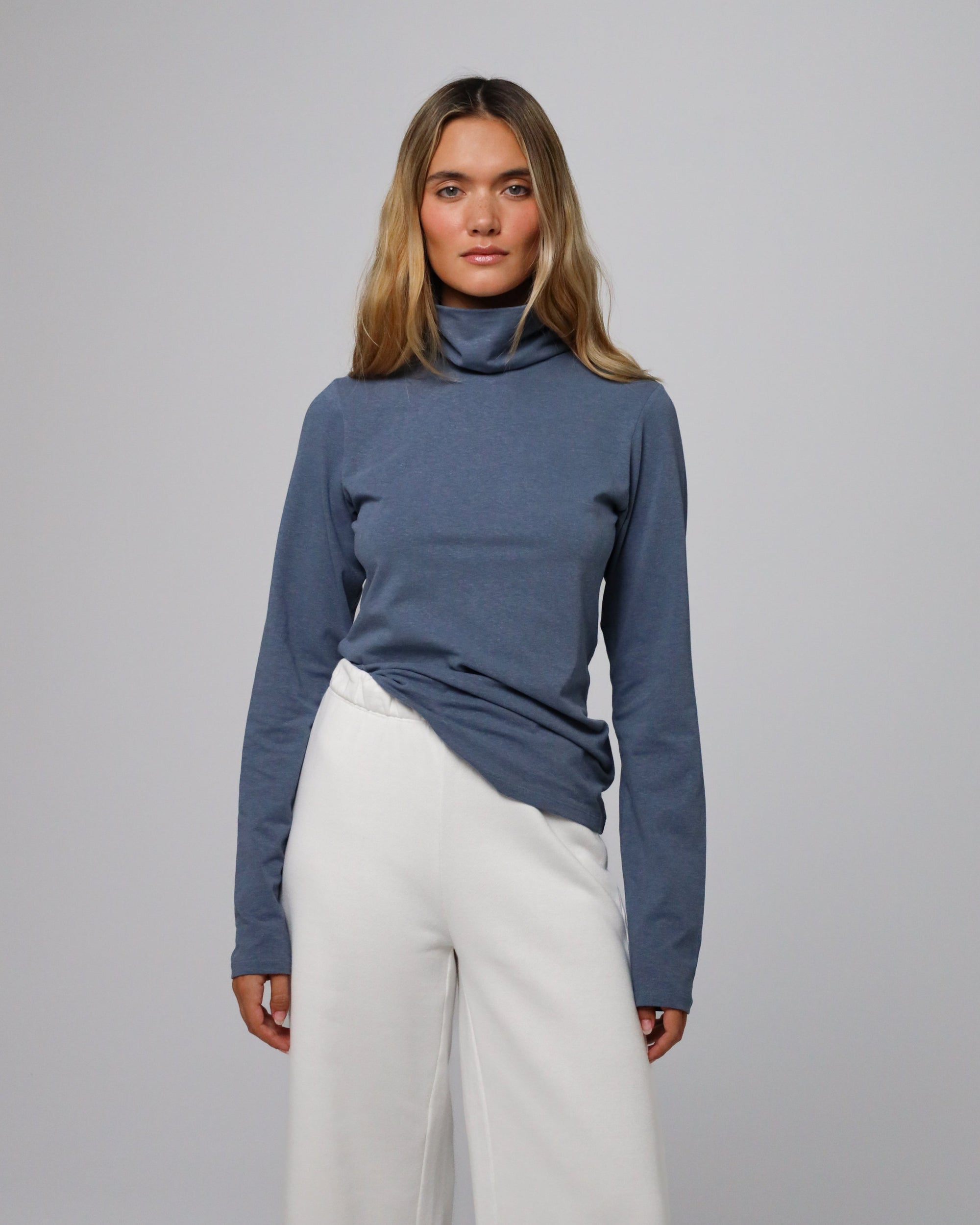 Detail shot of the mockneck collar and shoulder seam on the Hemp Essentials Mockneck (blue).