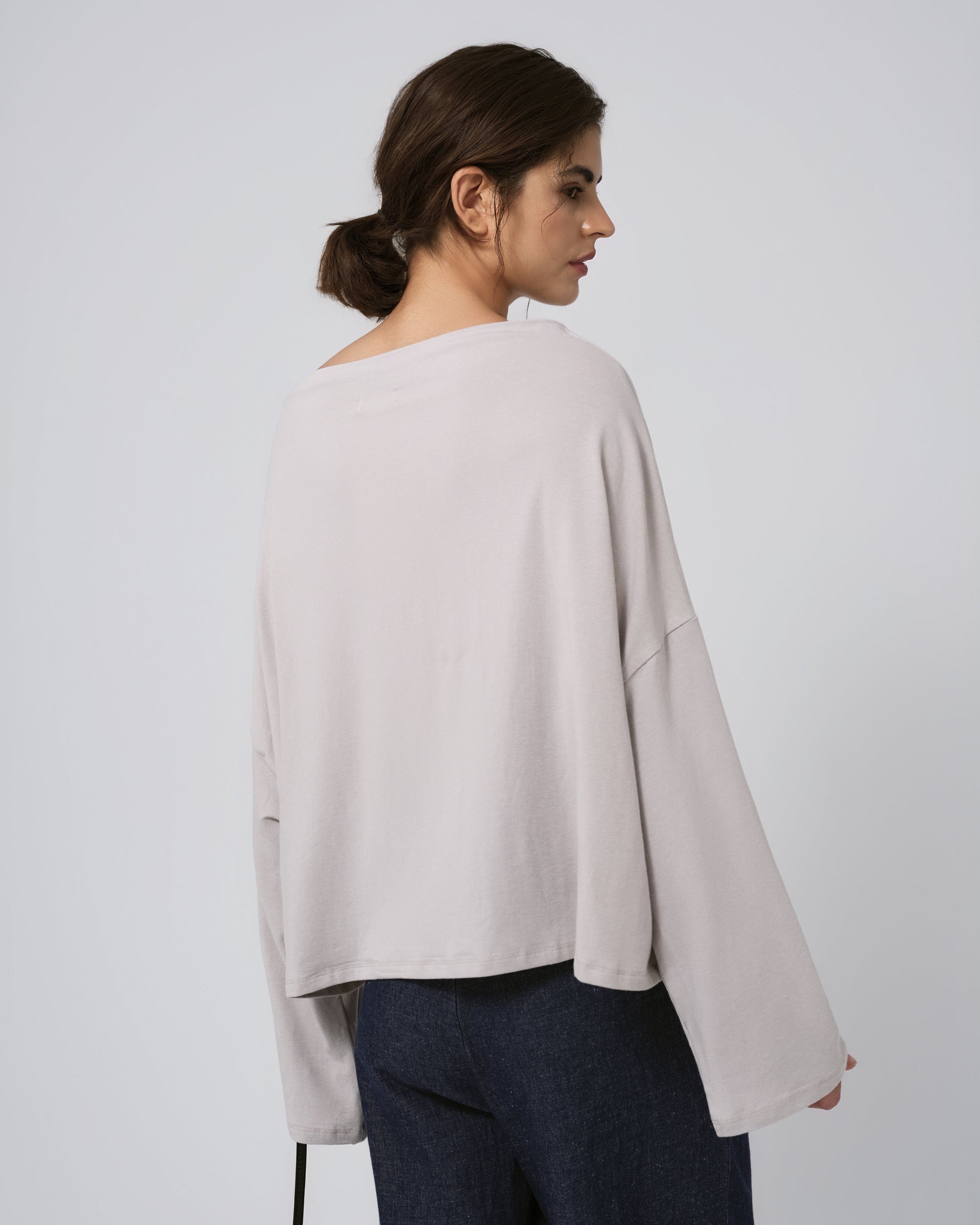 Model back view of ash off-the-shoulder hemp–organic cotton top; clean back and natural drape.