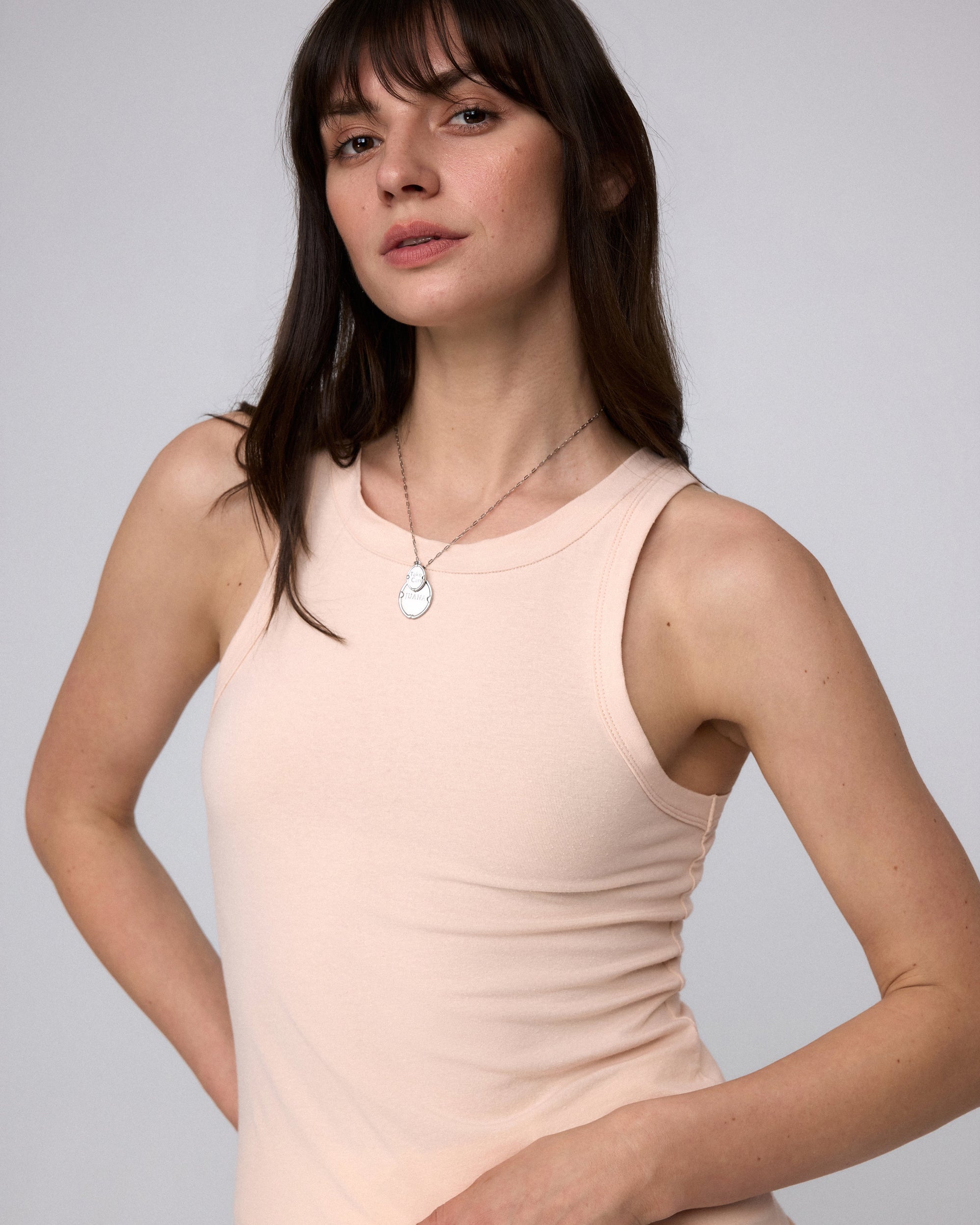 Juana Hemp Essentials Tank peach (organic cotton–hemp blend) model detail showing neckline and fabric texture