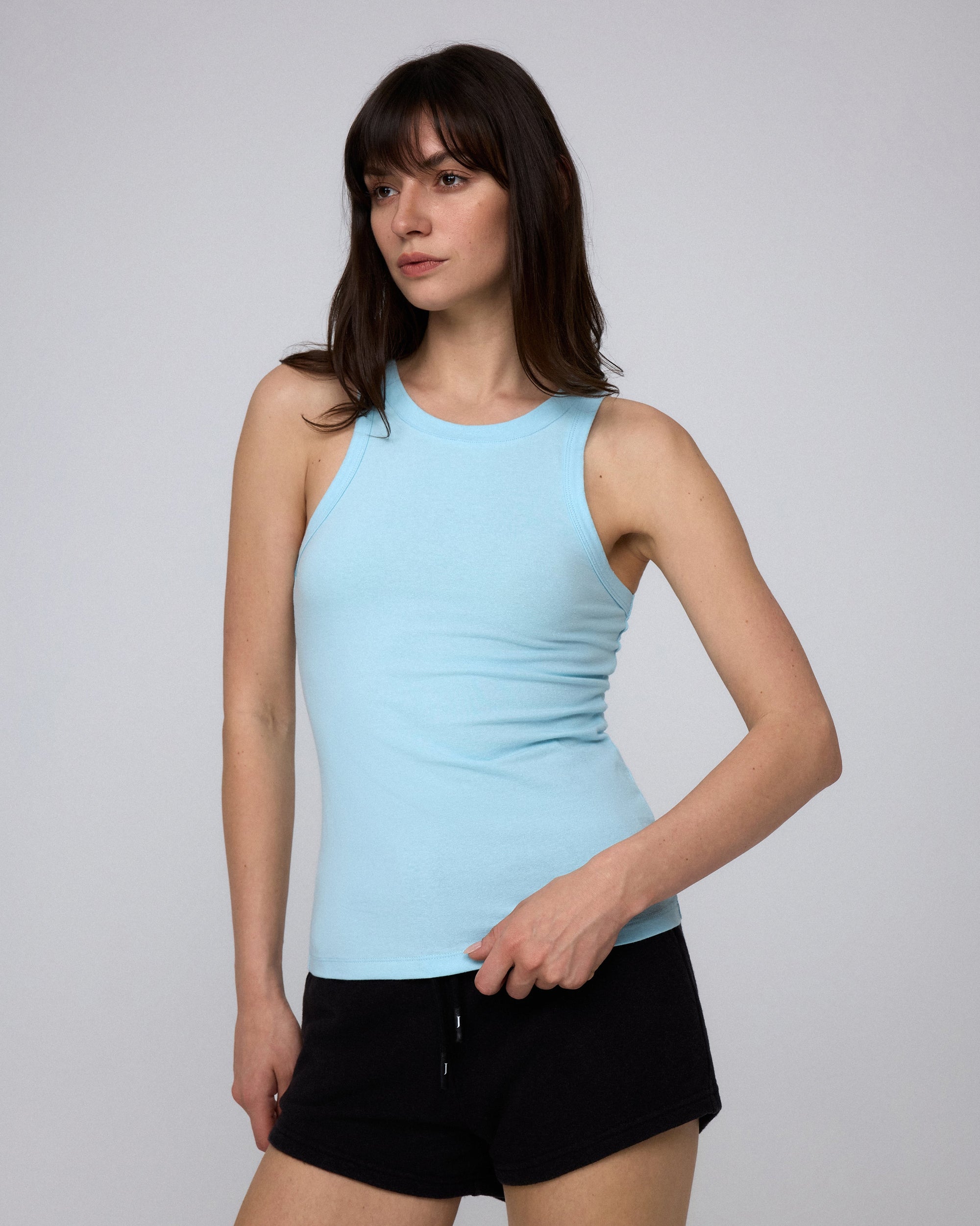Juana Hemp Essentials Tank sky blue (organic cotton–hemp blend) side view on model showing slim profile