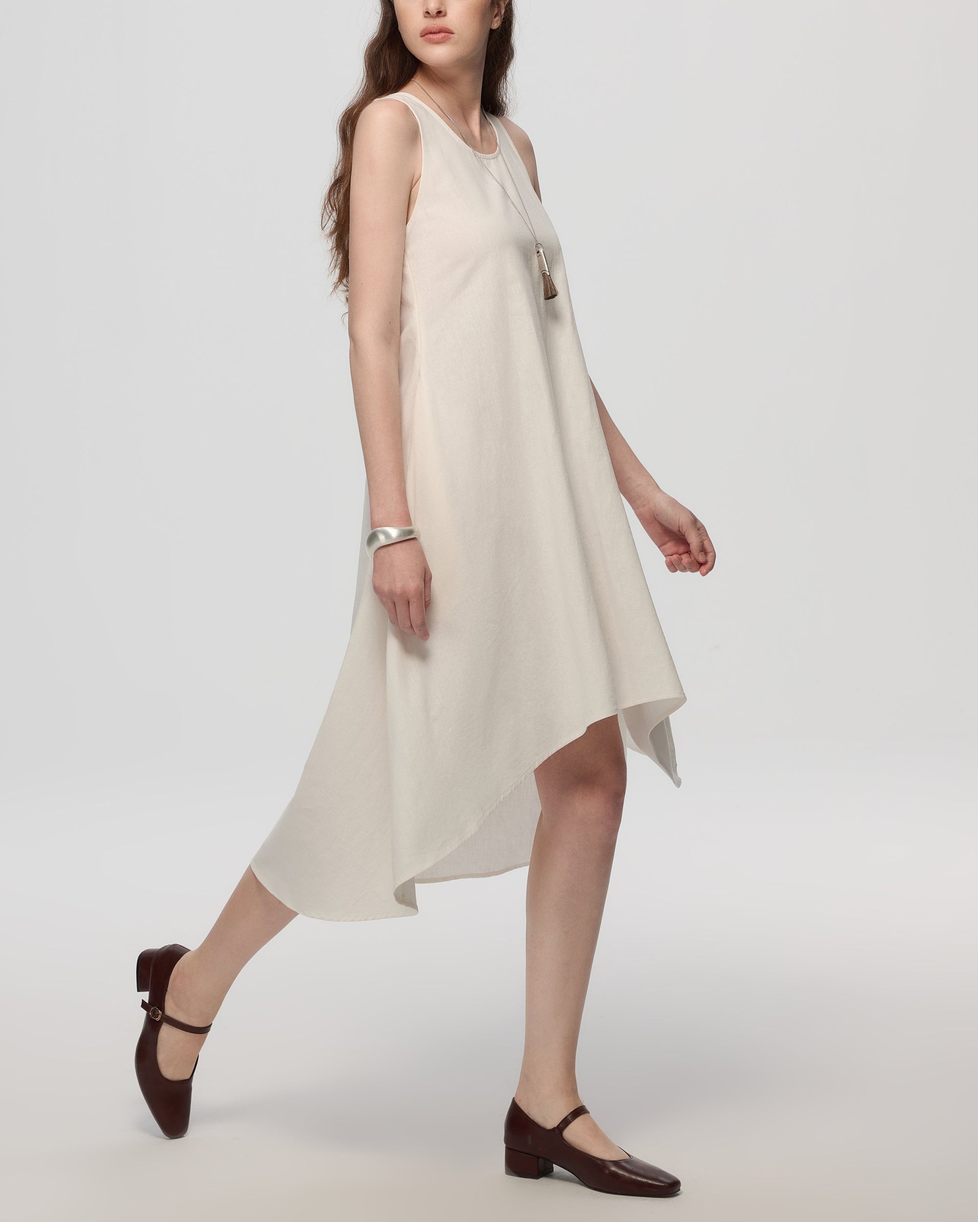 Juana Hemp High Low Dress white (hemp–cotton) on model side view showing high-low hemline