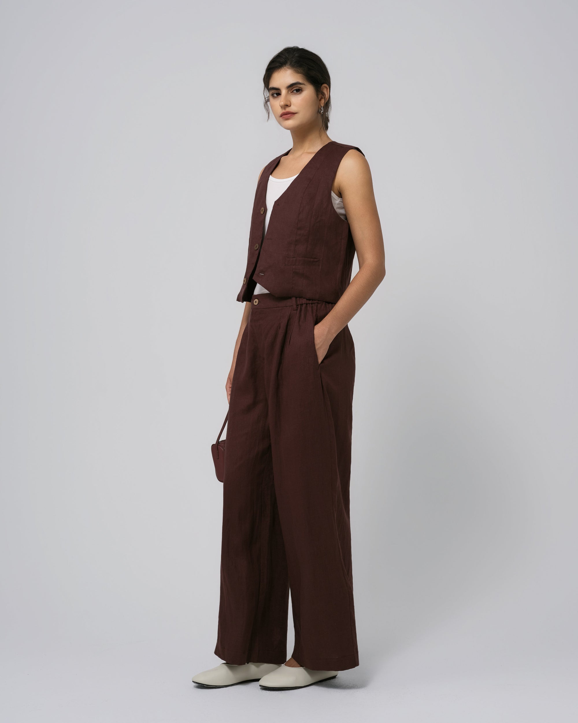 Full-body view of Juana Hemp Vest amd High Rise Pants in expresso; seasonless, sustainable styling.