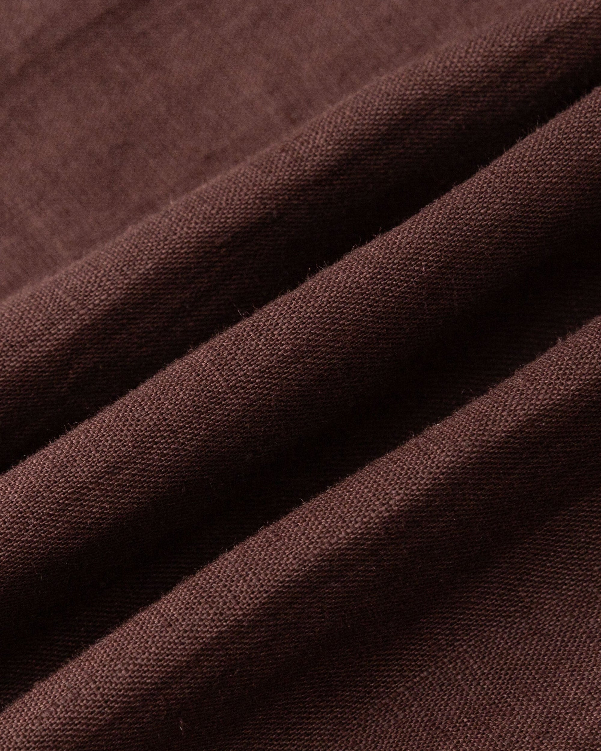 Textile close-up of expresso 100% hemp weave; breathable natural fiber texture.