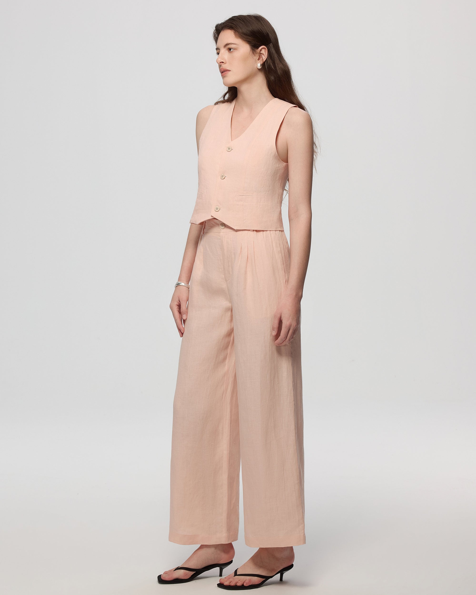 Juana Hemp High Rise Pants Light Peach (hemp) on model showing tailored styling and tapered leg line.