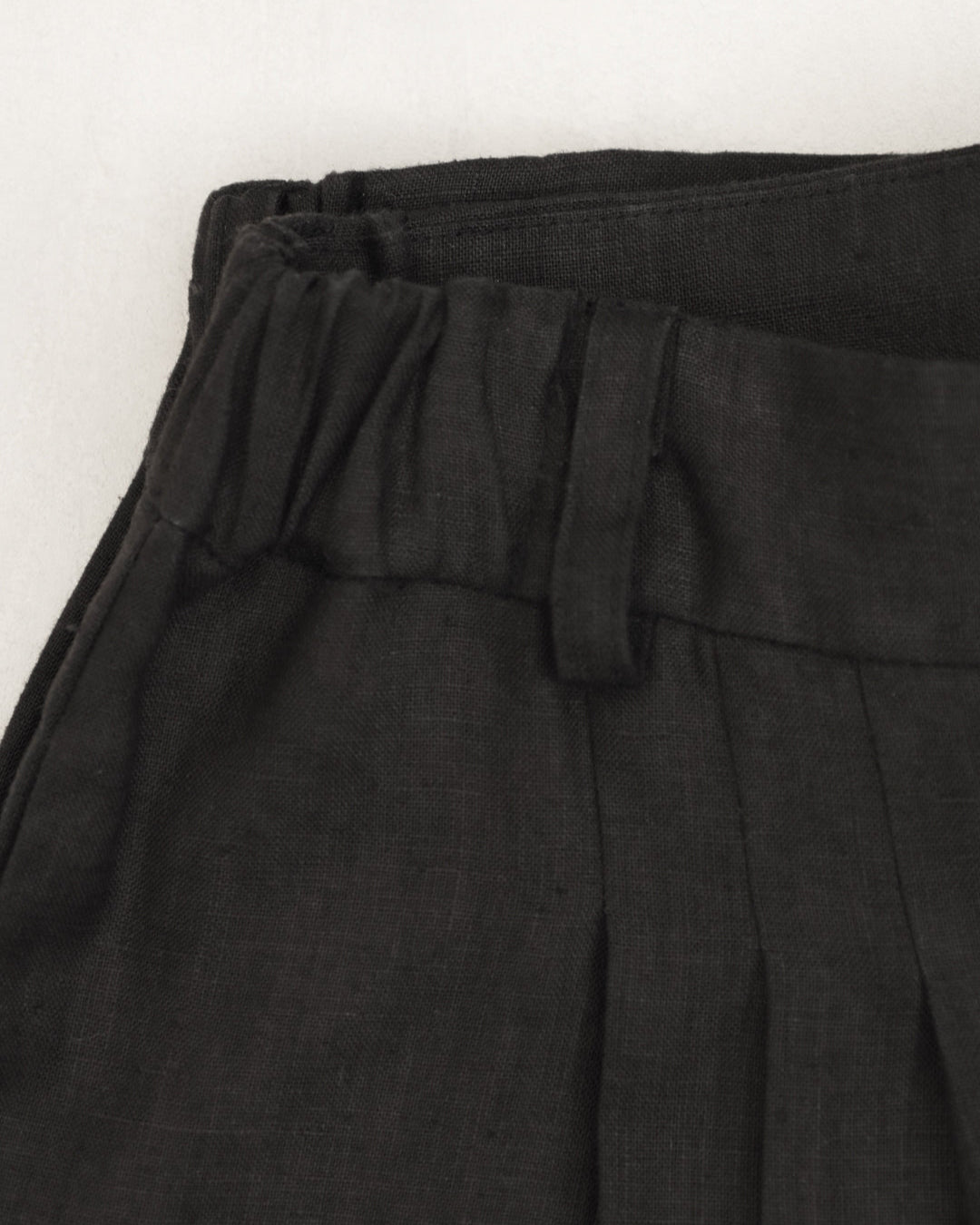 Flat lay of Juana Hemp High Rise Pants, showing texture and waistband details.