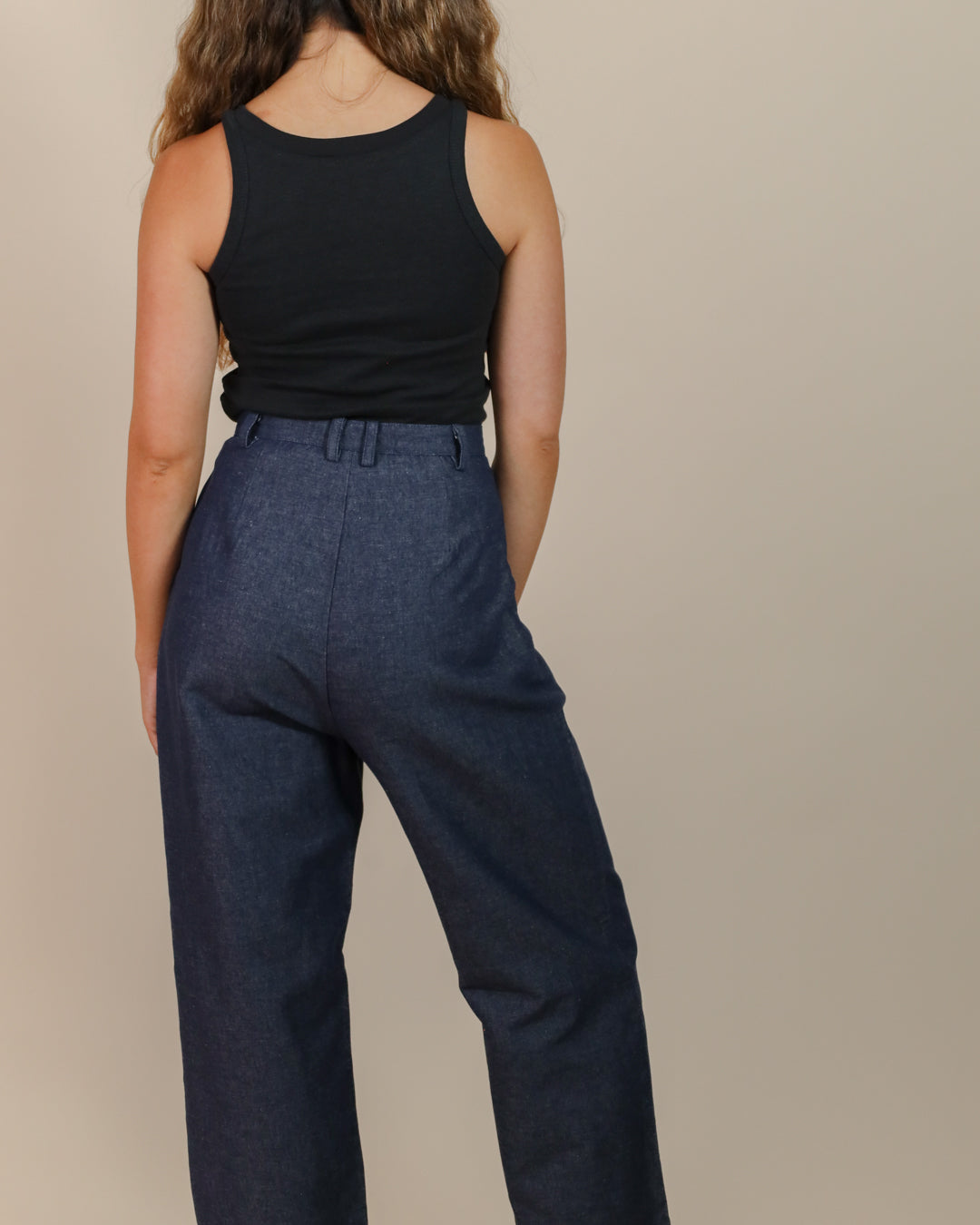 Close-up of waistband and back details on Juana Hemp High Rise Trousers, highlighting fabric texture and stitching.