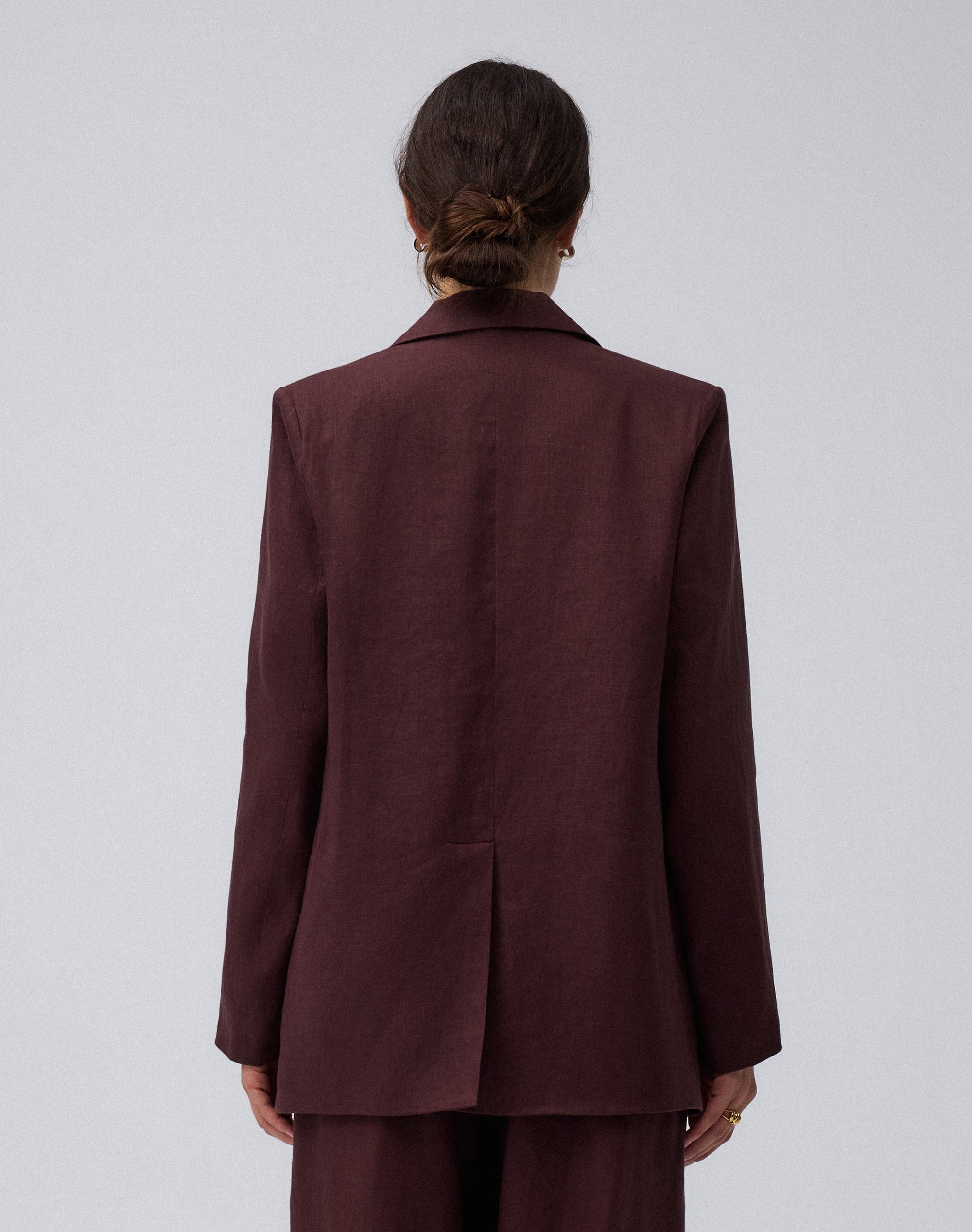 Juana Hemp Tailored Blazer in espresso (hemp) modeled from the back showing the clean structured shape