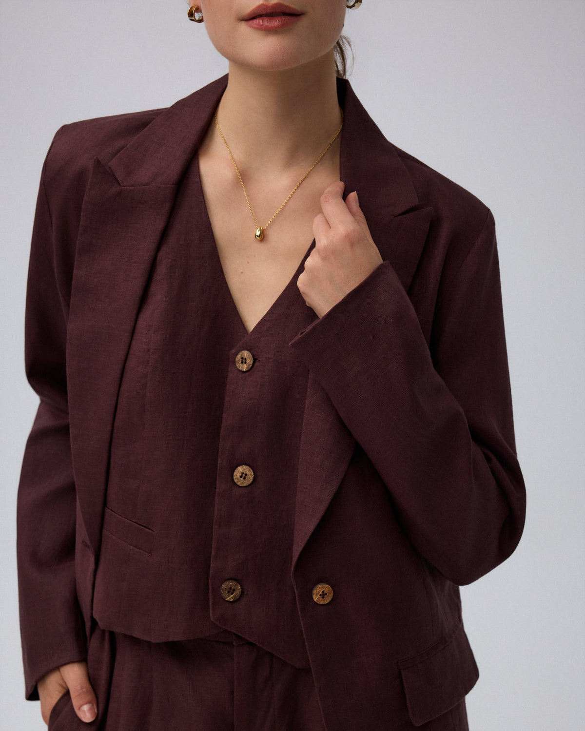 Juana Hemp Tailored Blazer in espresso (hemp) model detail showing textured fabric, coconut buttons, and pocket construction