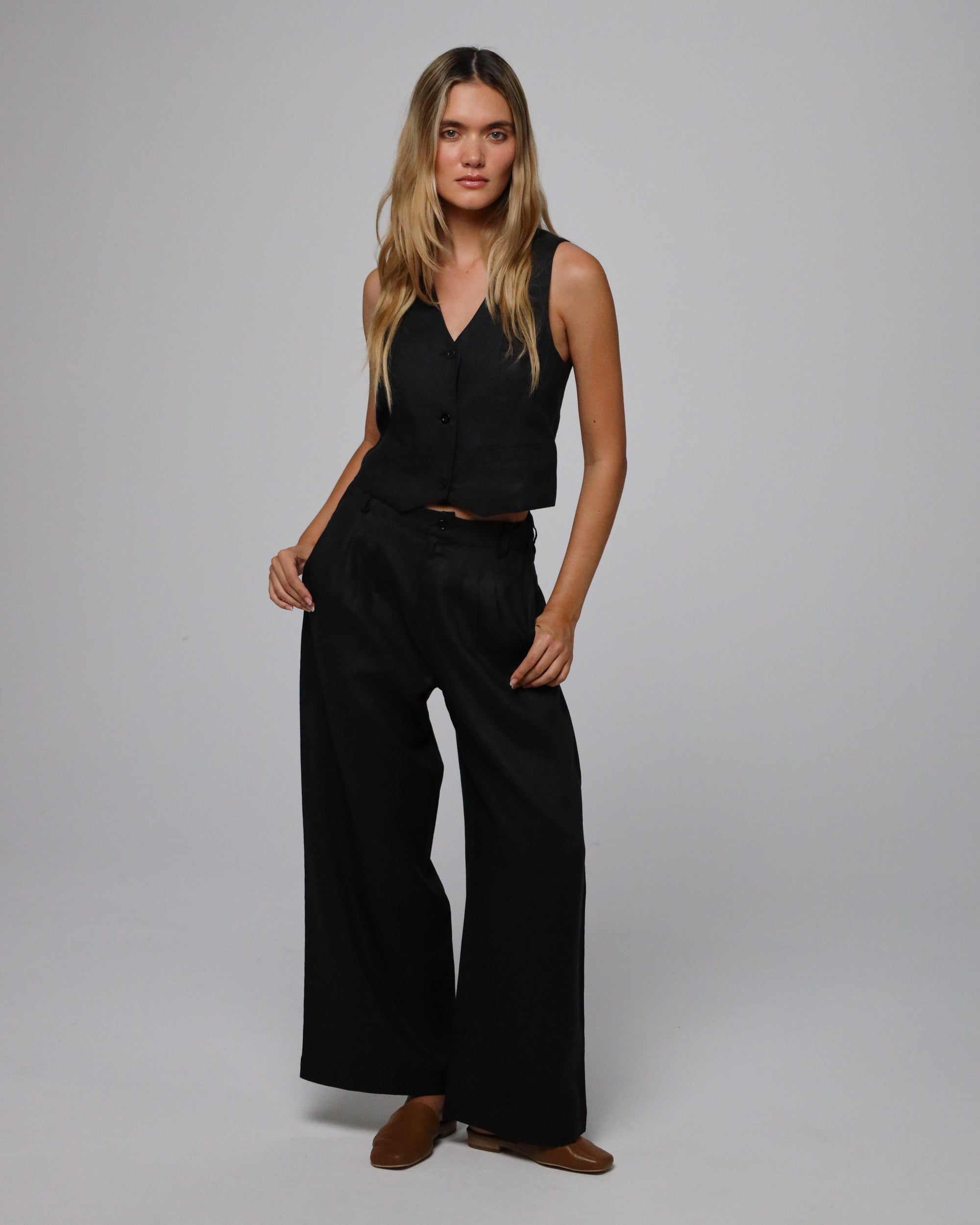 Woman wearing Juana Hemp Tailored Vest and High Rise Pants in 100% hemp (natural), styled for sustainable everyday wear.
