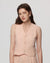 Model wearing Juana Hemp Tailored Vest in light peach (hemp), showing tailored fit and clean V-neck front.