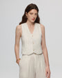 Model wearing Juana Hemp Tailored Vest in white (hemp), styled for polished layering with a minimal silhouette.
