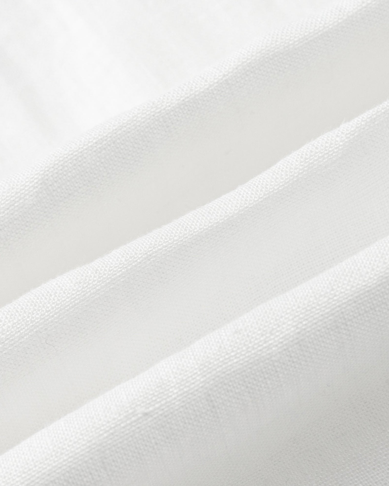 Close-up of Juana Hemp Tailored Vest fabric in white (hemp), highlighting woven texture and natural structure.