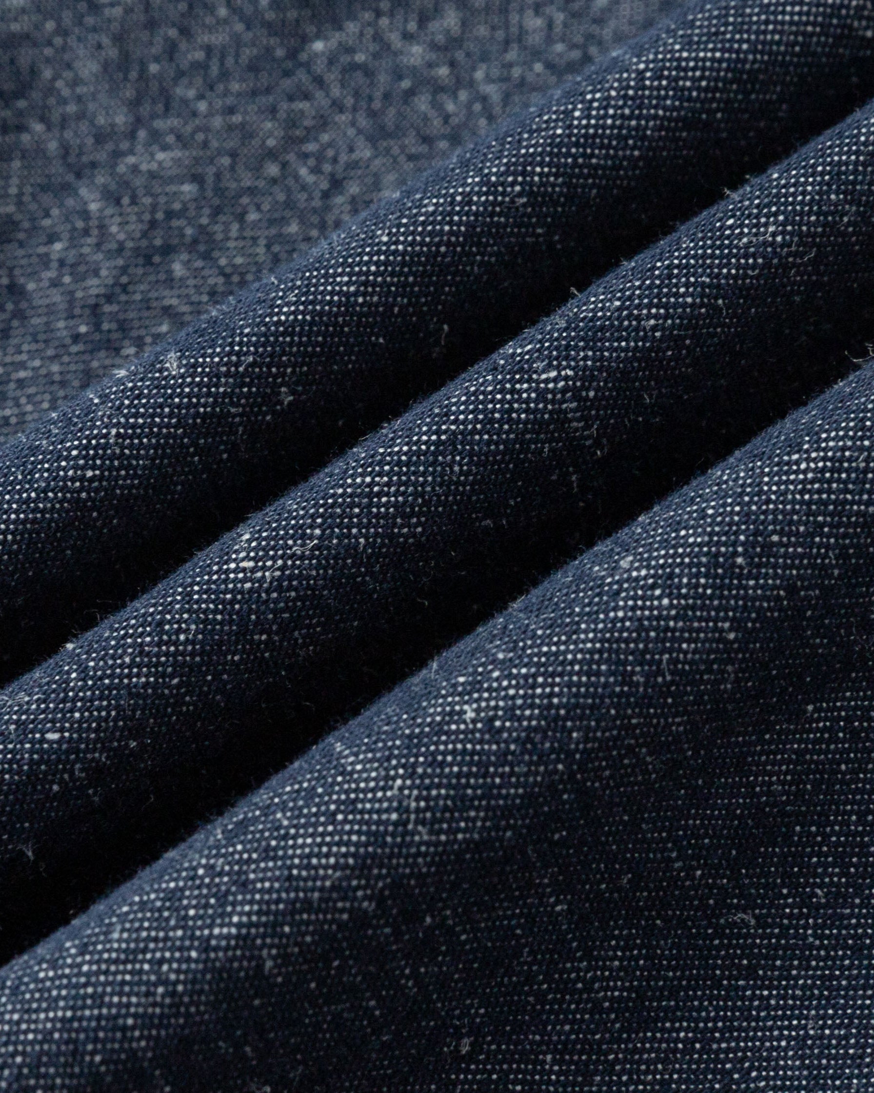 Close-up of hemp–cotton denim fabric of the High Rise Trousers (indigo denim), highlighting breathable, durable weave.