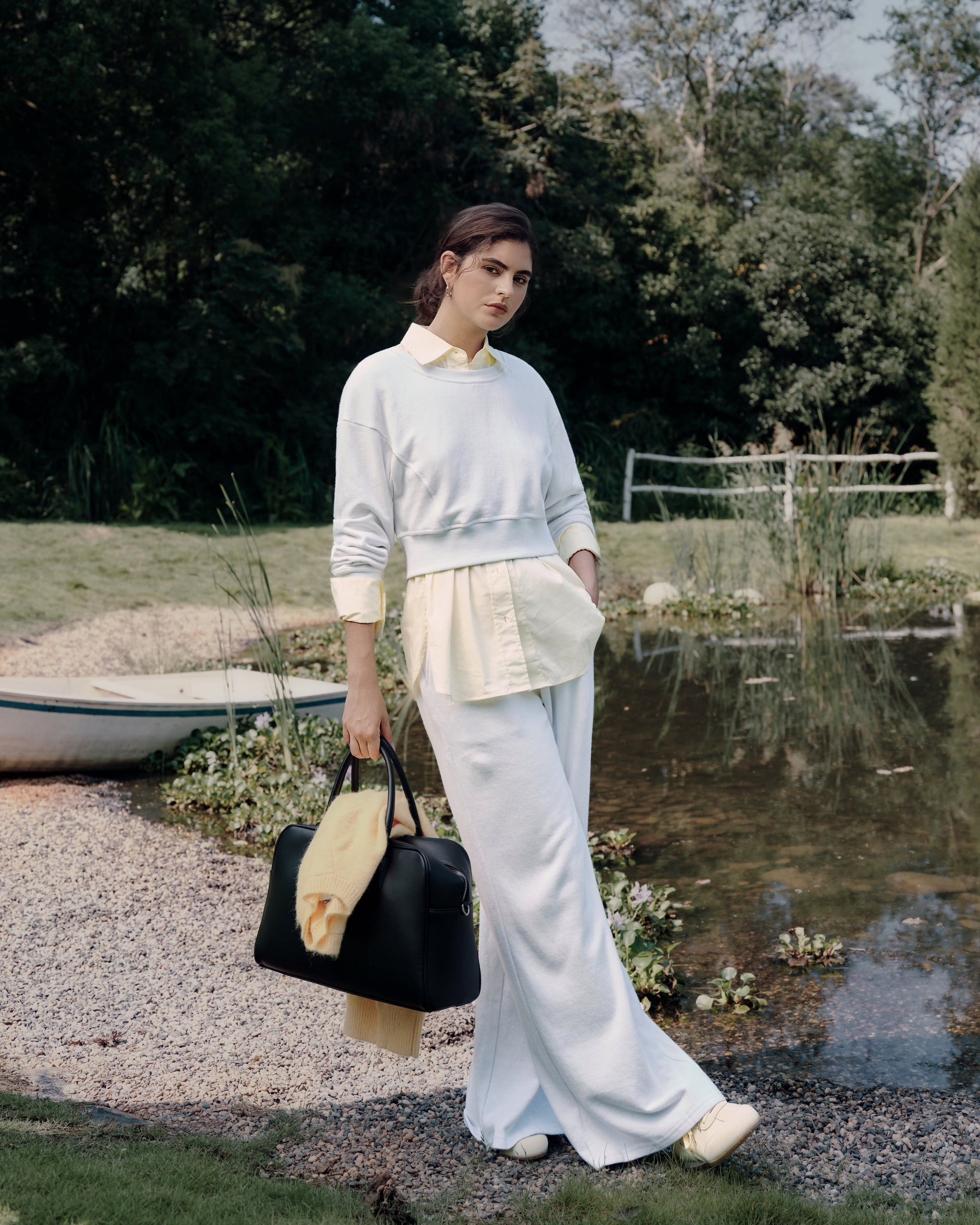 Standing by the lake, capturing the white fleece set (hemp–organic cotton) over long light-yellow shirt.