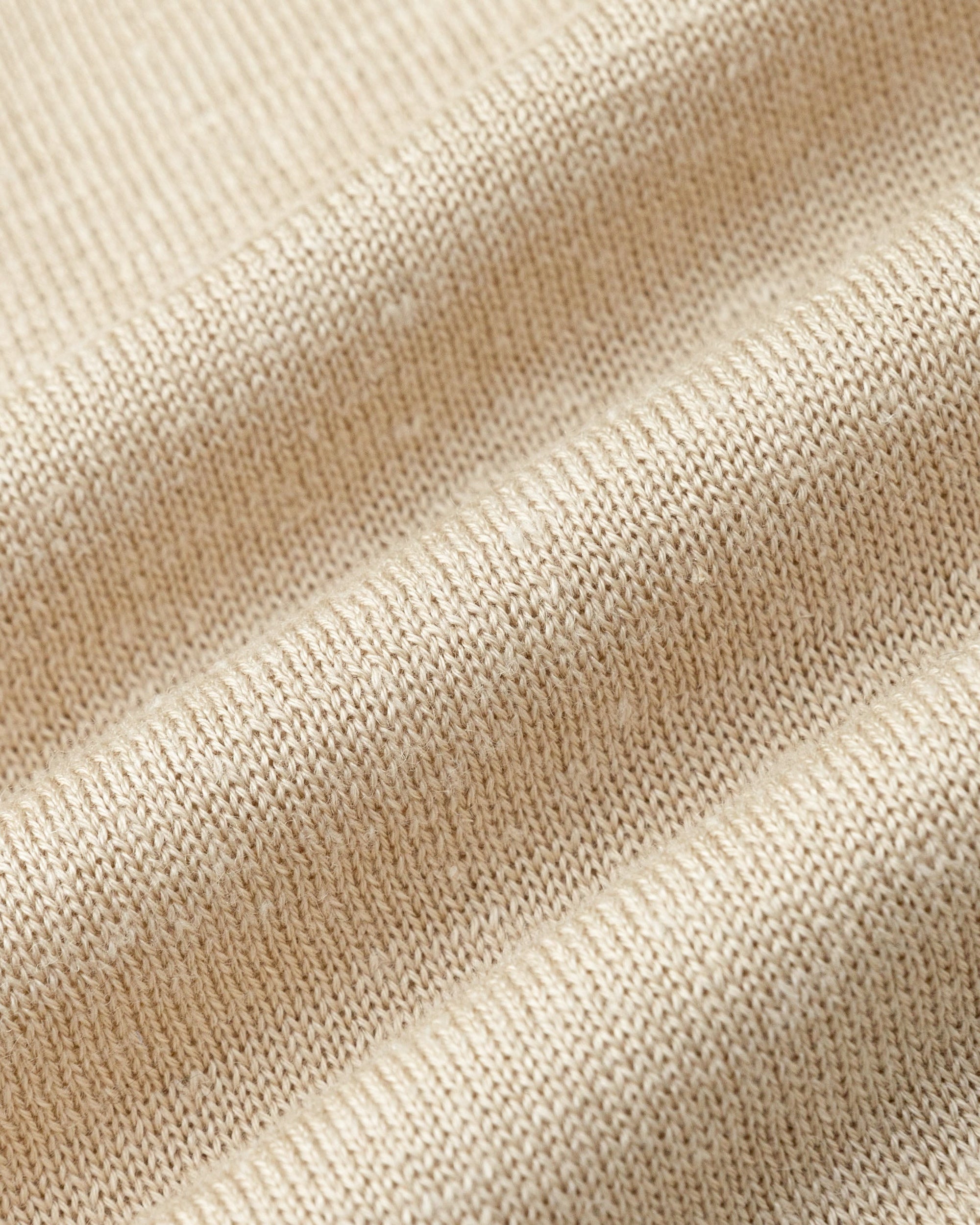 Close-up of merino–silk–hemp knit of Liora Cardigan (beige), highlighting breathable softness and subtle sheen.