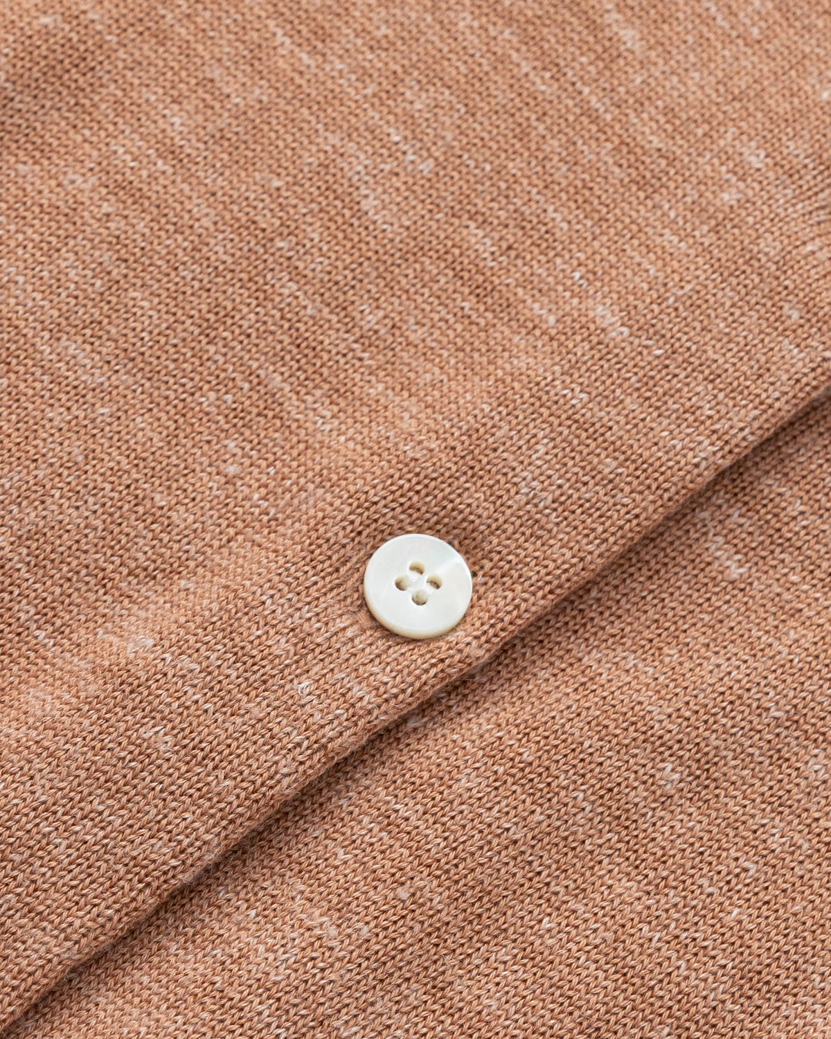 Flat lay of Liora Knitted Hemp Cardigan (chestnut), showing knit structure and finishing.