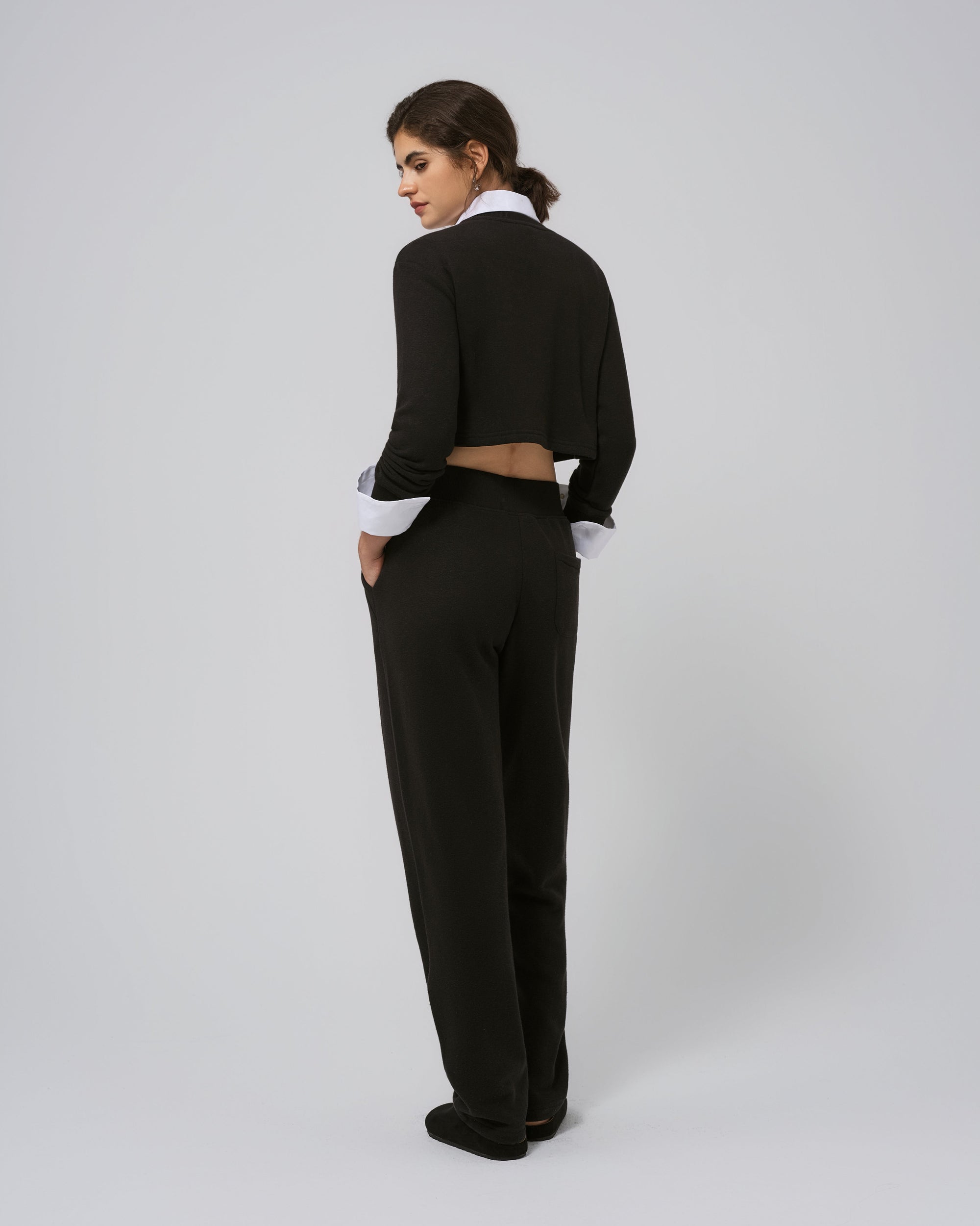 Back view of black Off Hours set; smooth sweater back and jogger taper.