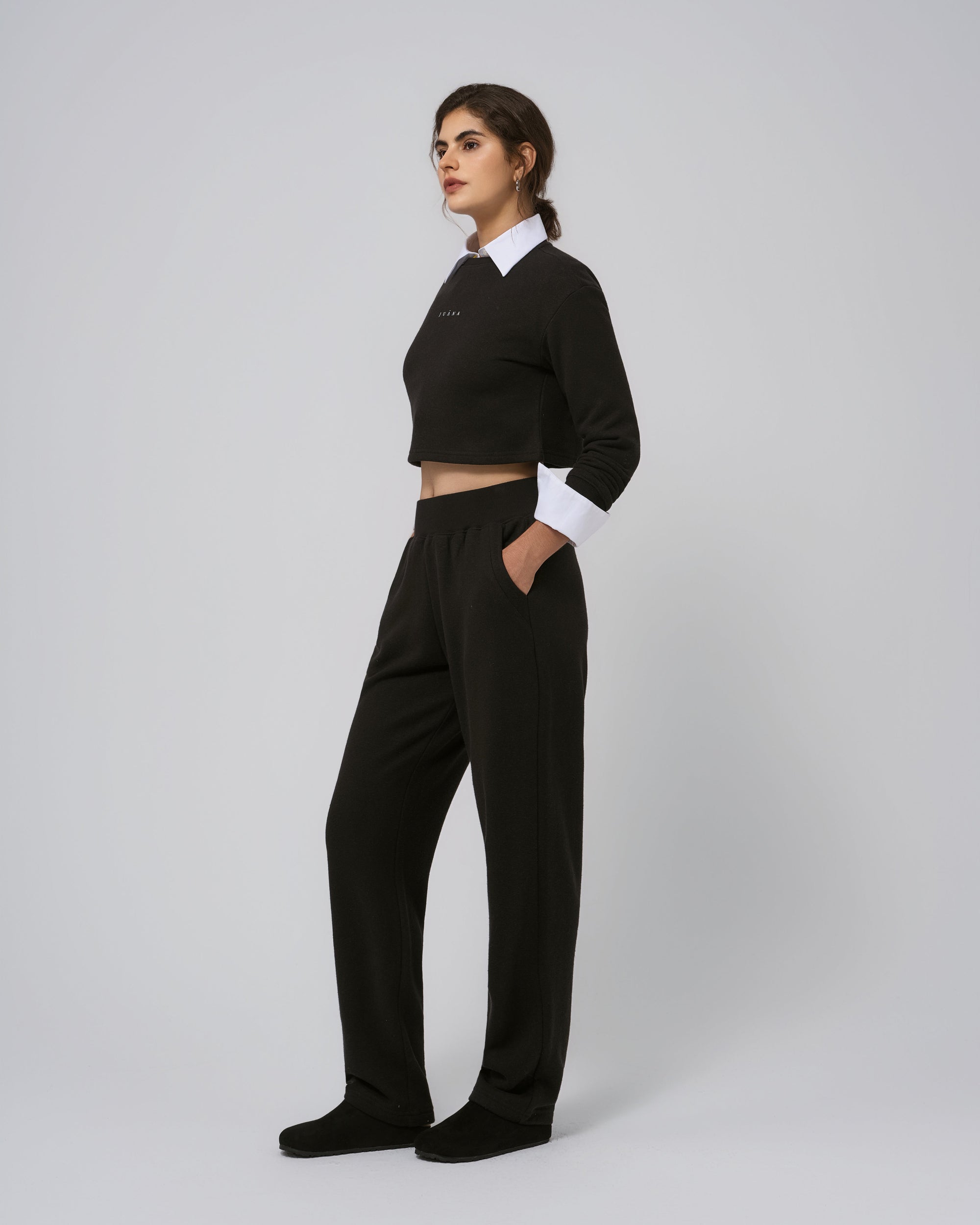 Full-body view of Off Hours set black; seasonless lounge-to-street.