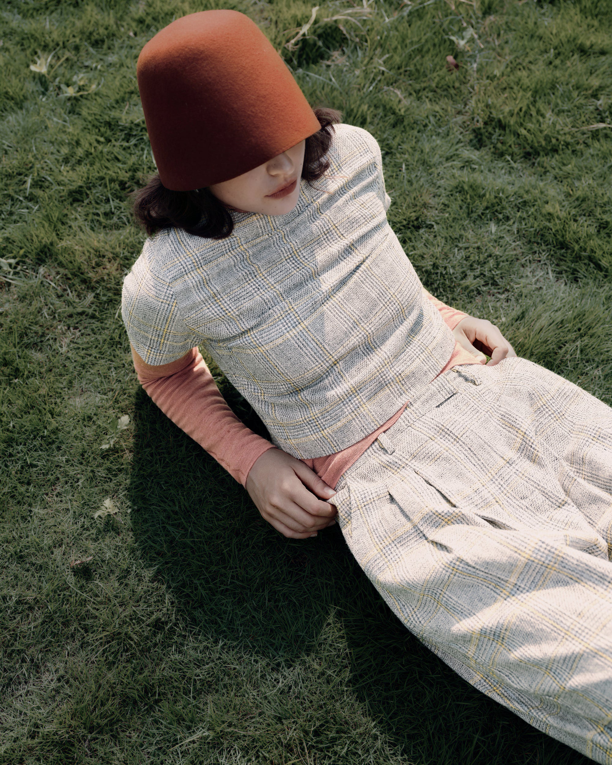 Full-body view of combined look—Ossa Turtleneck (Mocha Mousse) + Plaid Theory Top (yellow–grey plaid)—styled head-to-toe.