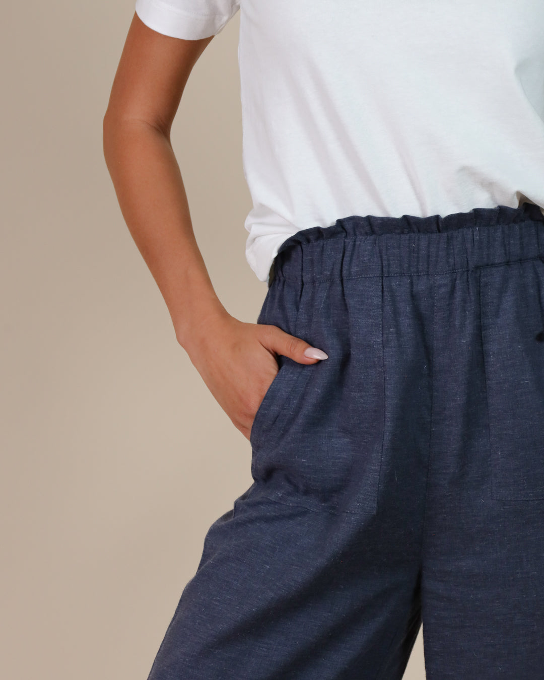 Close-up of Juana Lyricist High Rise Pull-on Pants waistband, and sustainable twill weave.